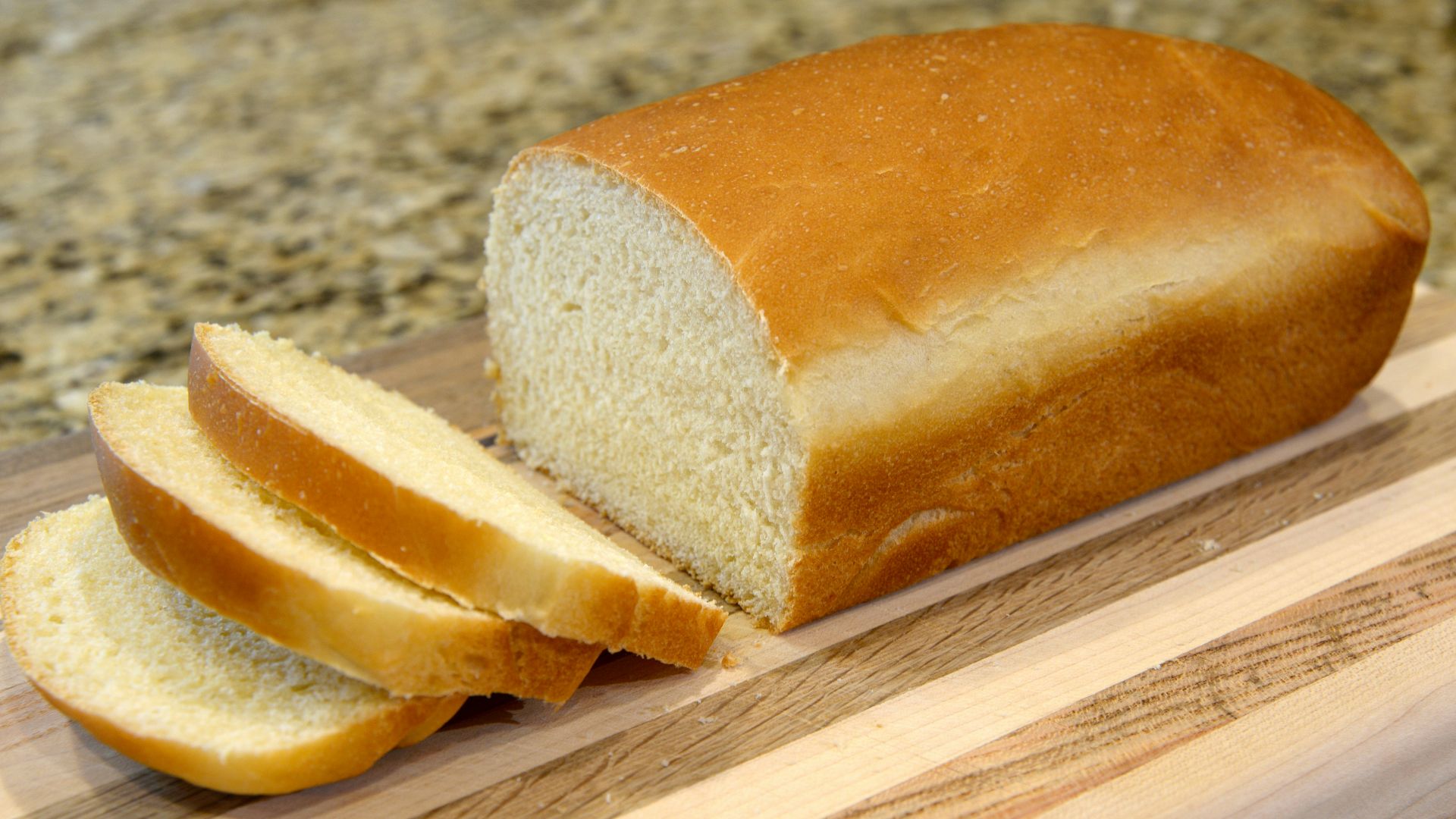 bread on brown wooden chopping board