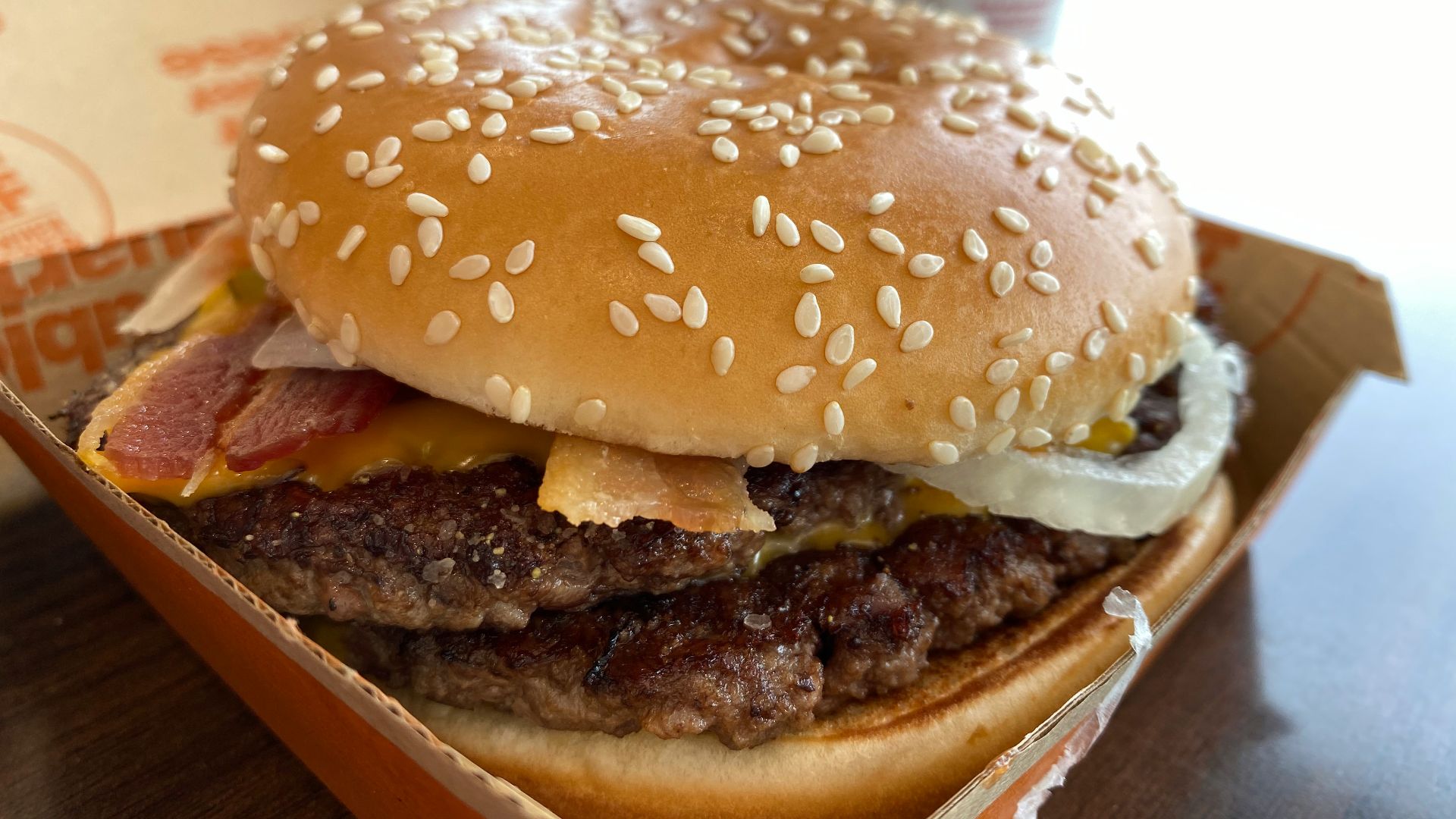 burger on brown wooden table