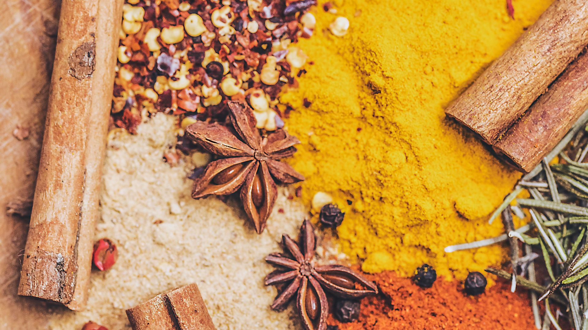 brown wooden chopping board with black beans and brown dried leaves