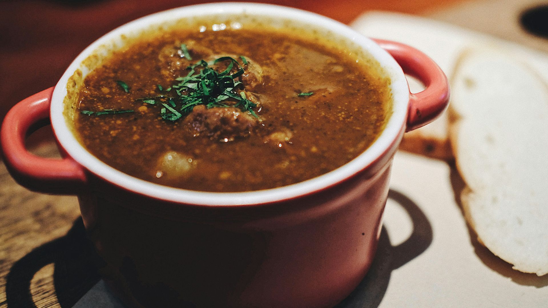 soup in maroon ceramic pot