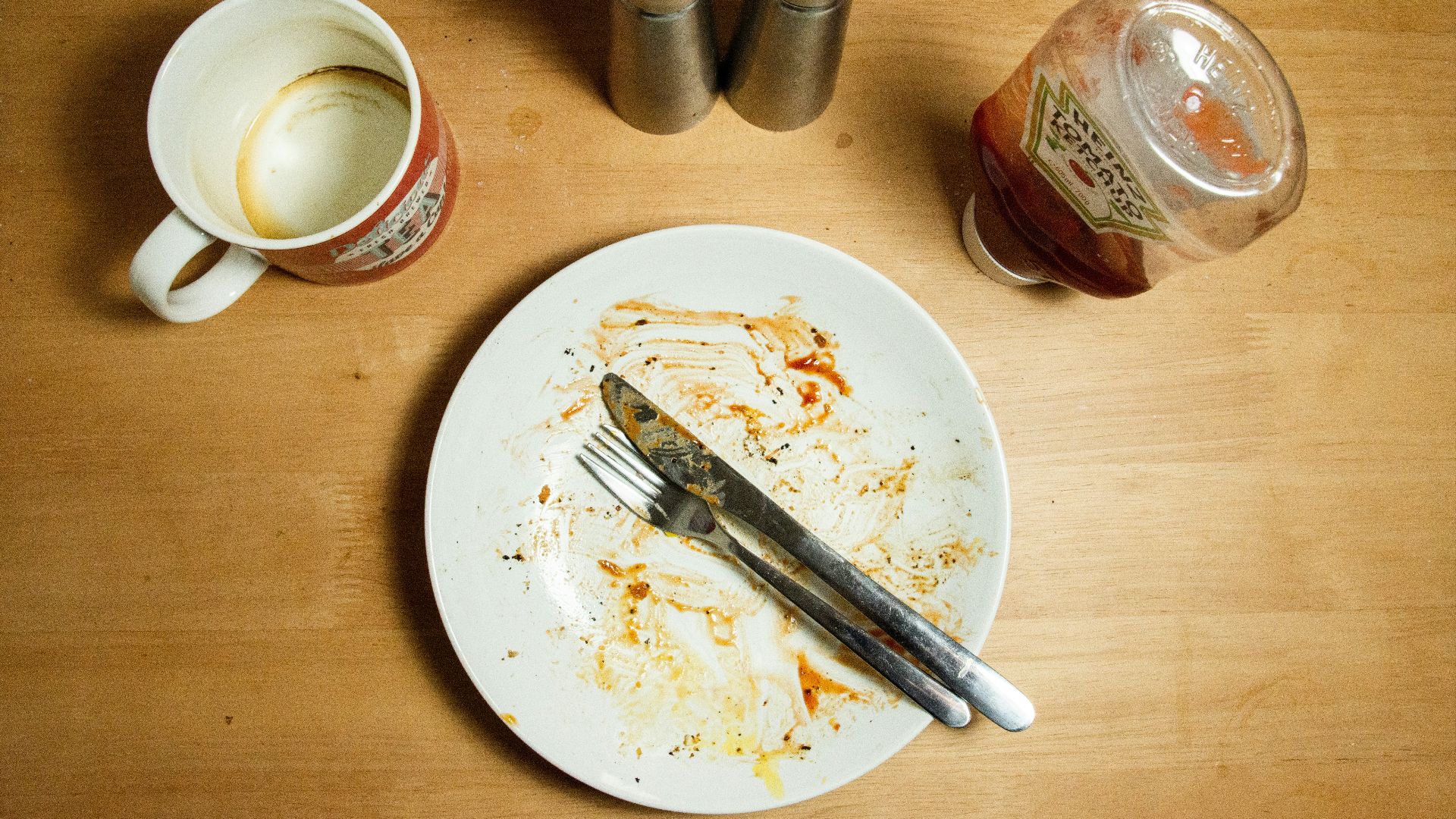 stainless steel fork and knife on white ceramic plate