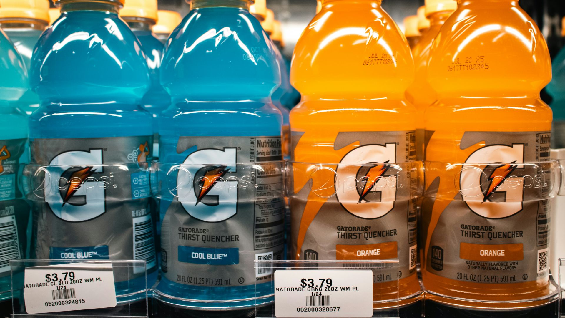 Gatorade bottles are stocked on a shelf.