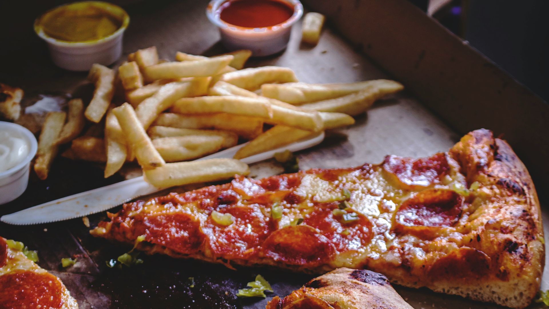 baked pepperoni pizza with French fries