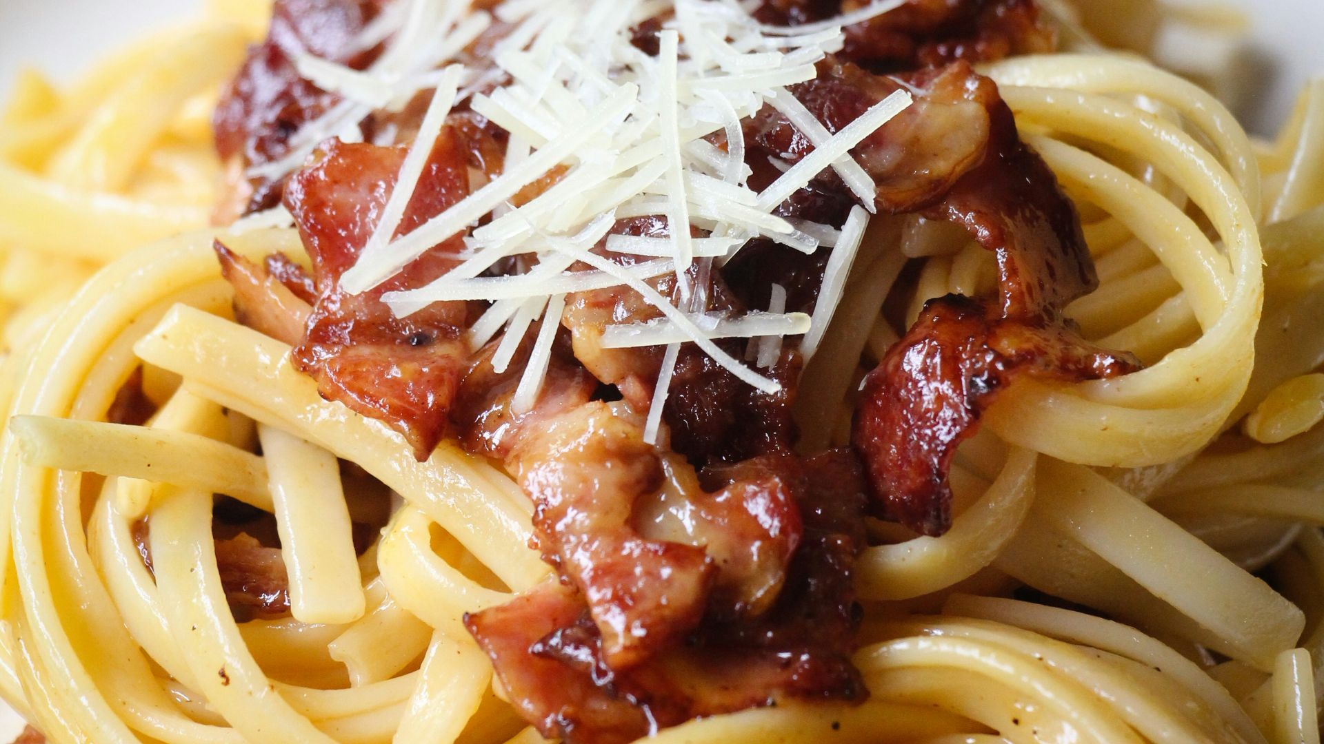 pasta with meat on white ceramic plate