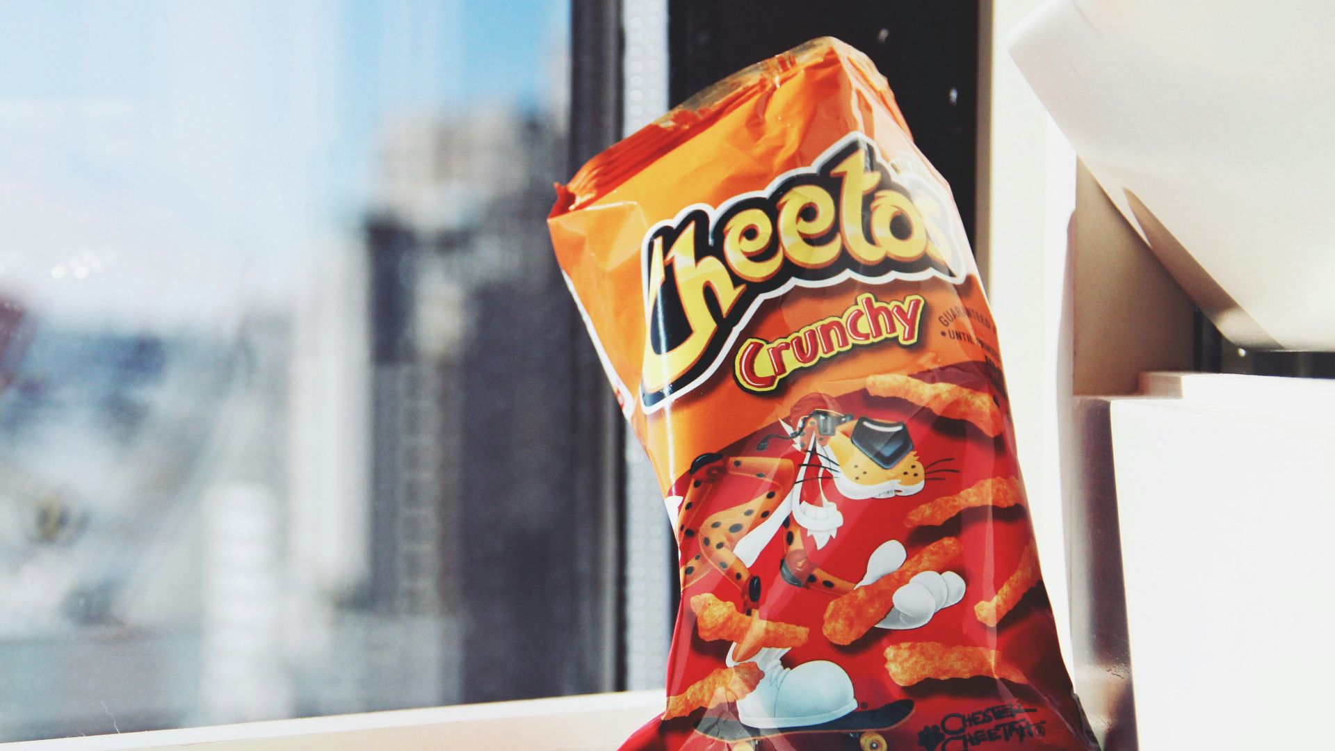 orange and yellow plastic pack on white table