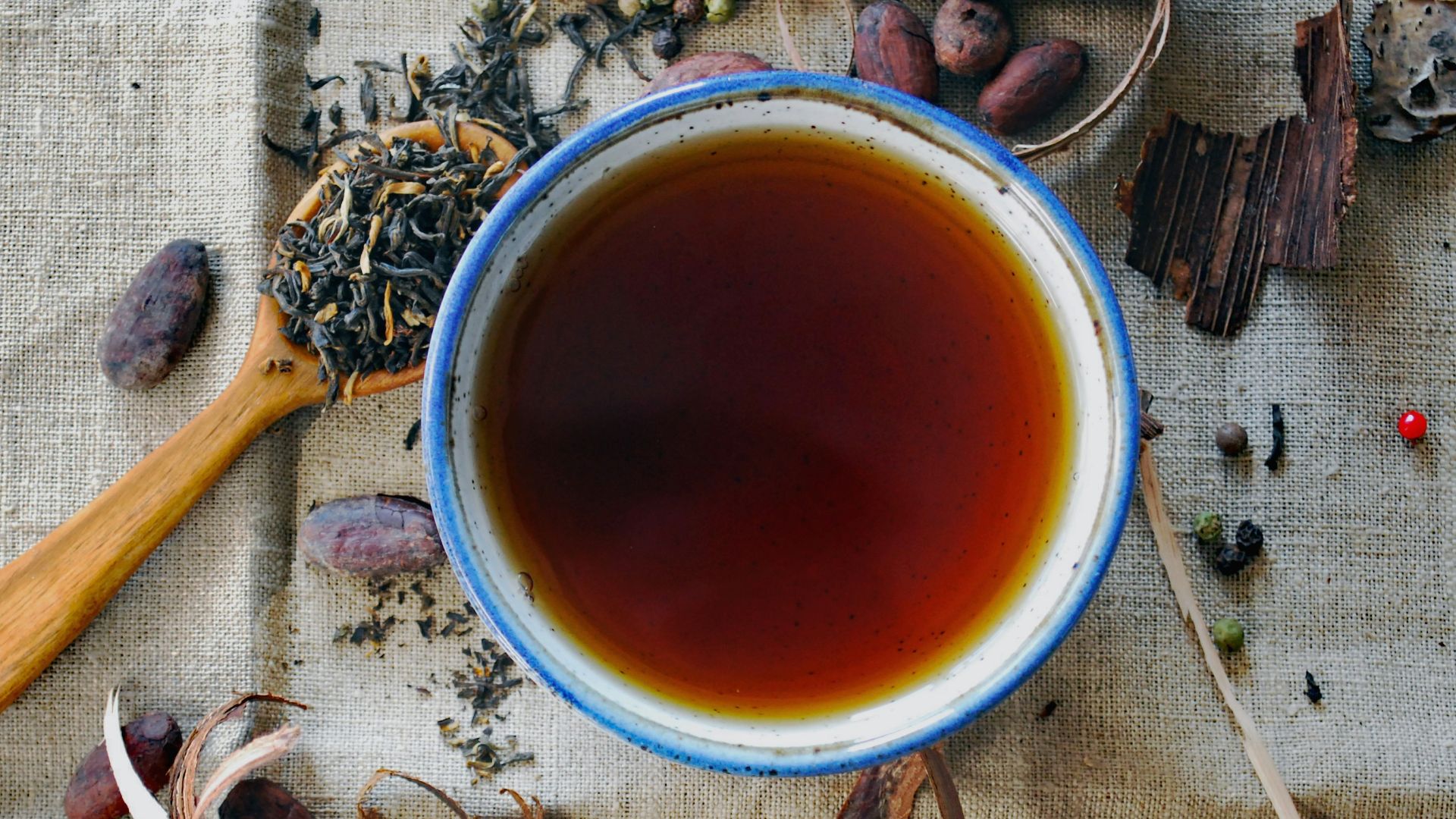 white and brown ceramic mug