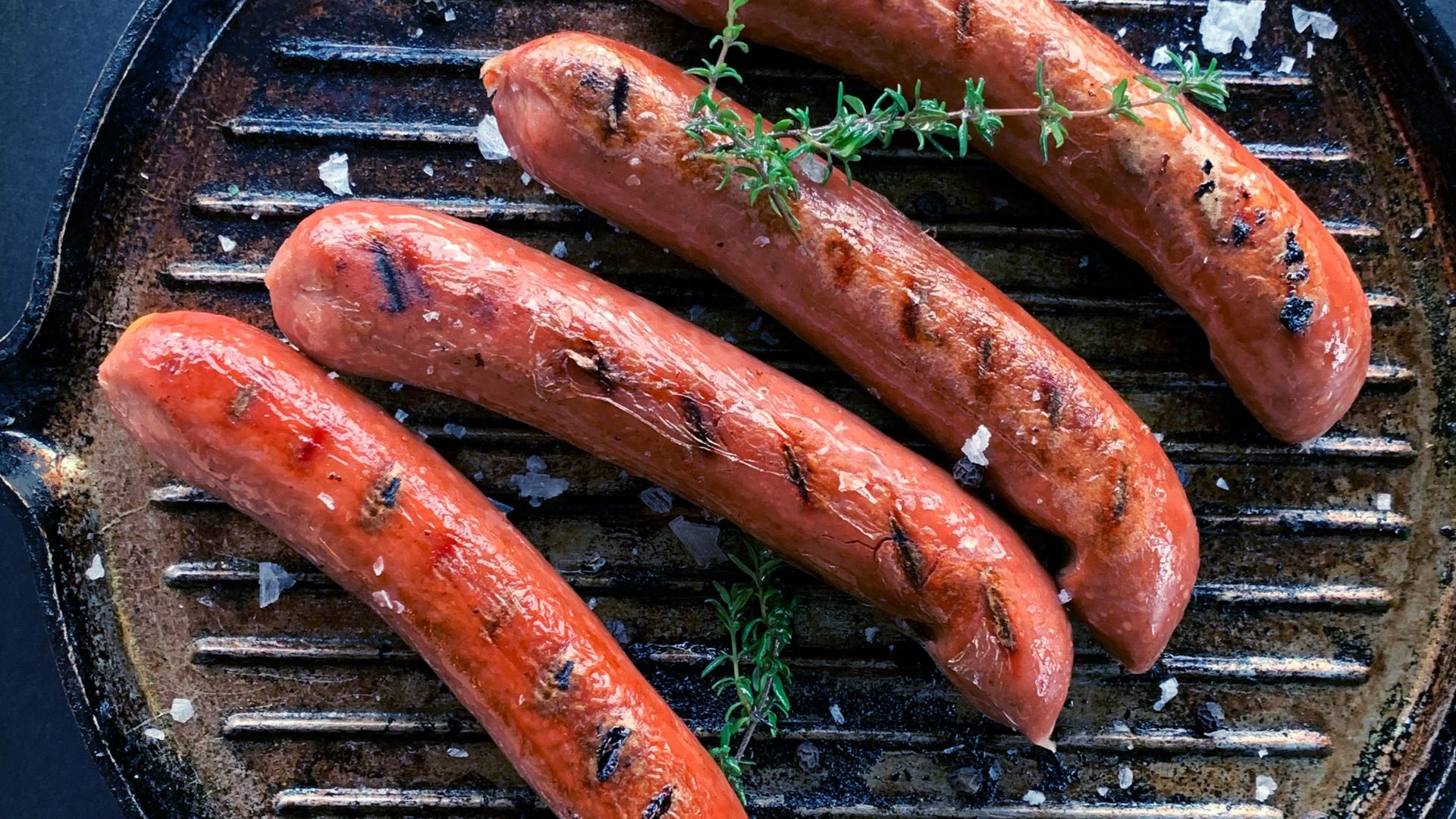 sausage on black round pan