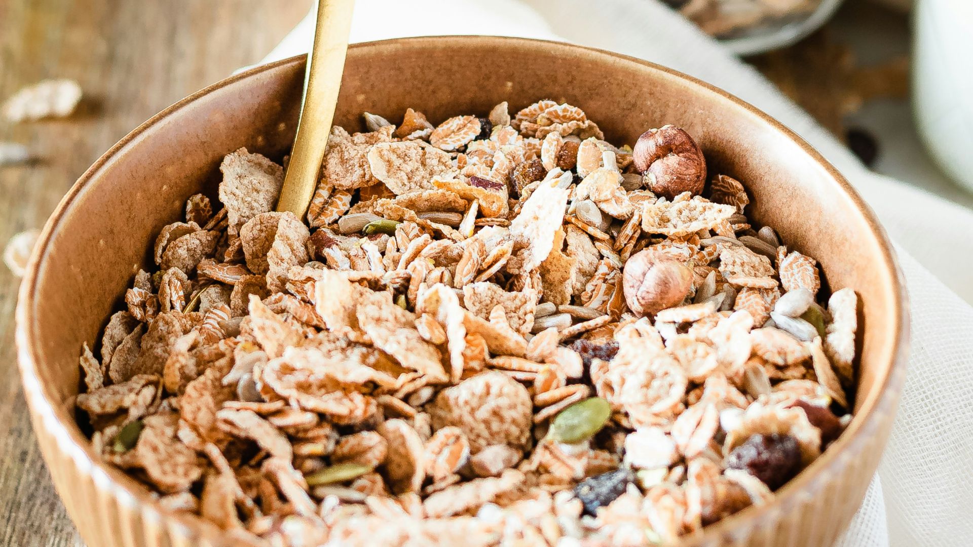 brown wooden bowl with brown wooden spoon
