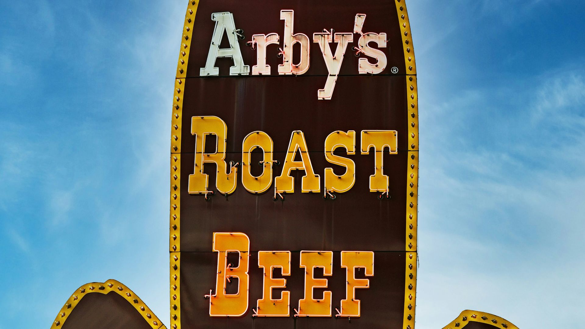 A sign for a restaurant called andy's roast beef sandwich