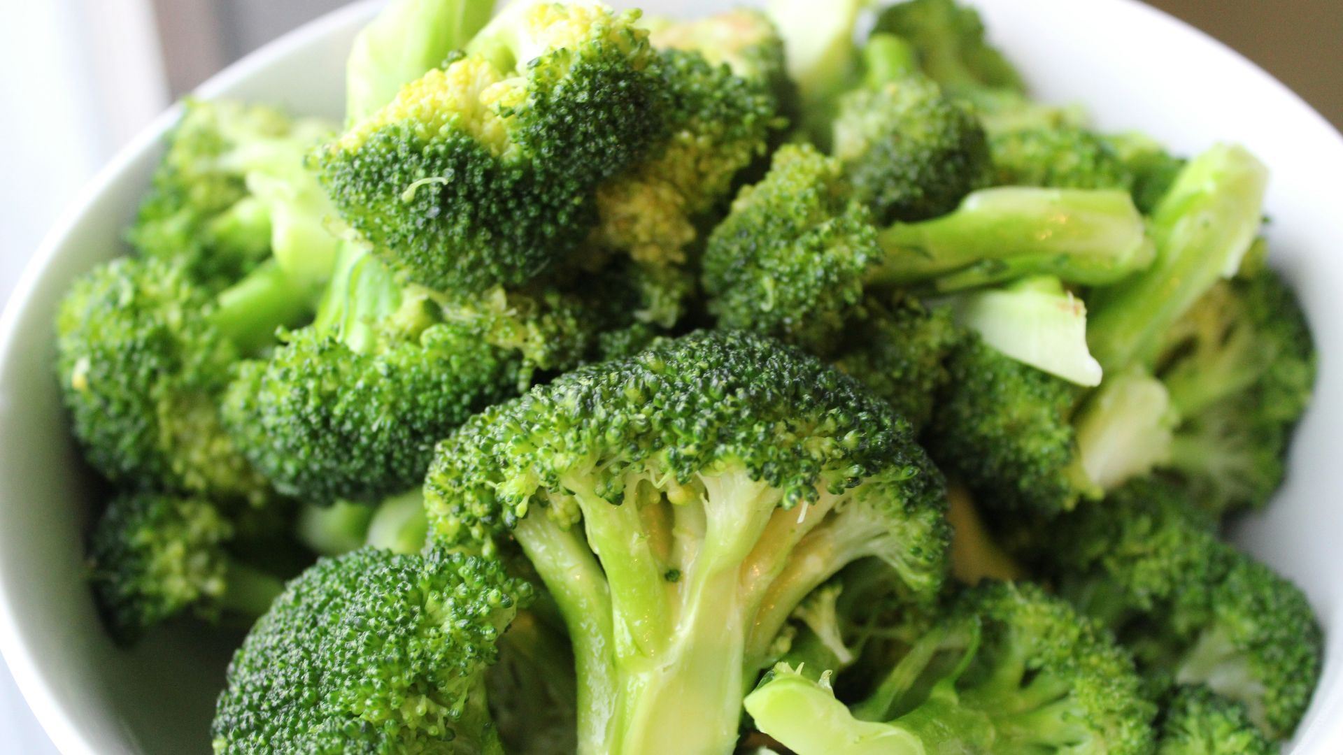 green broccoli on white ceramic plate