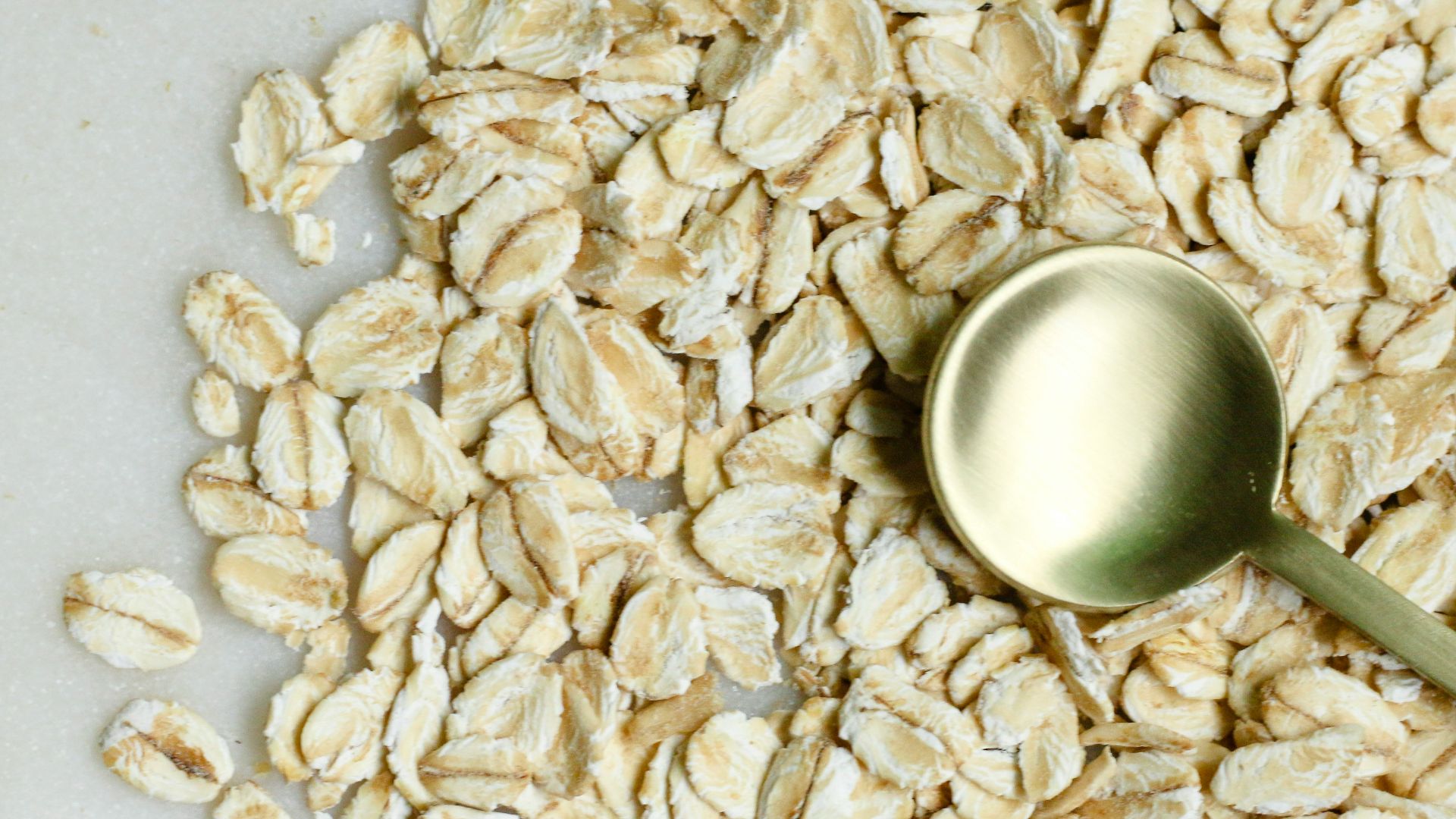 brown rice on white textile