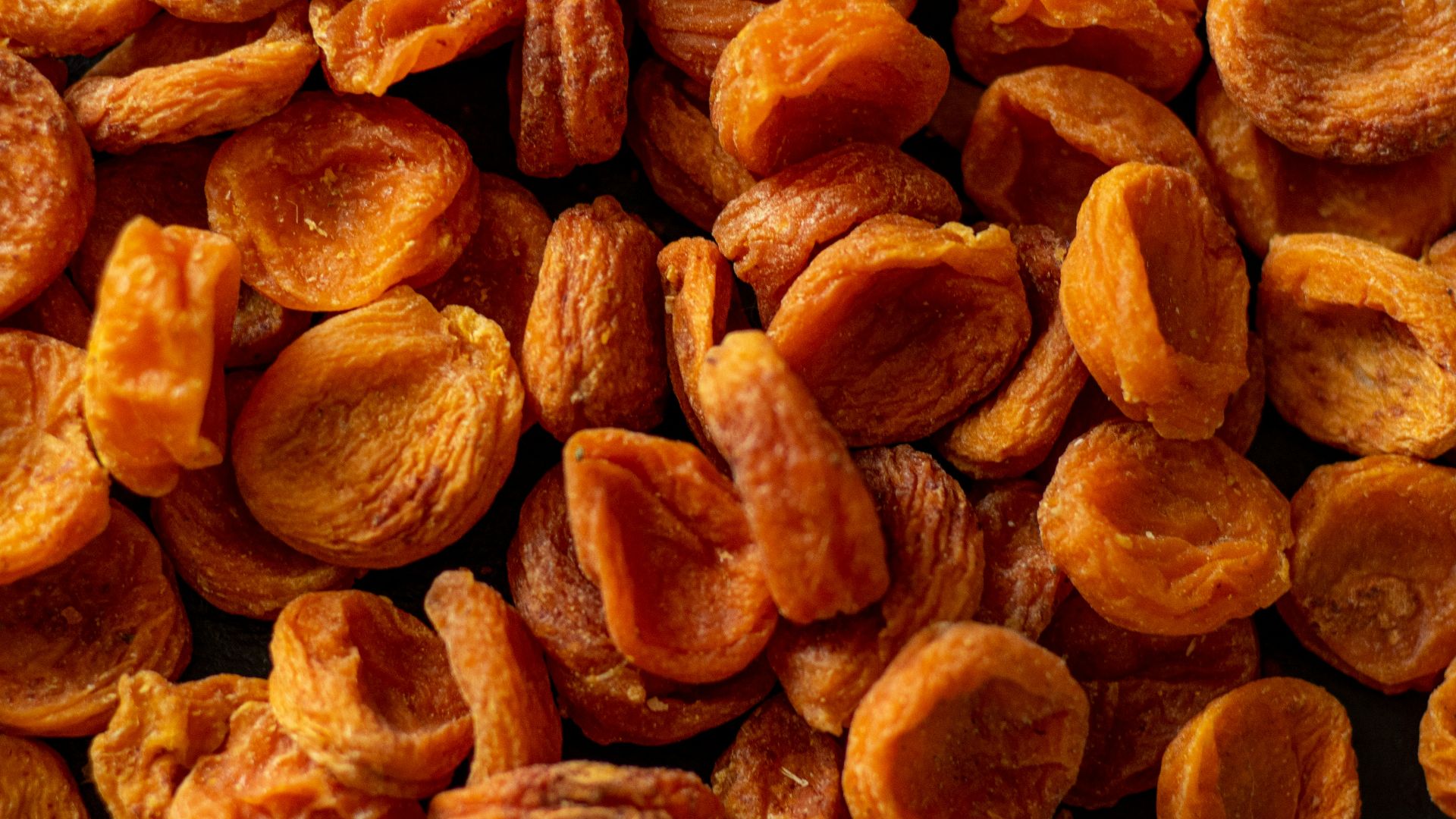 brown almond nuts on brown wooden surface