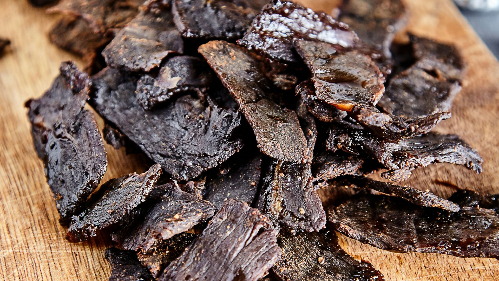 a wood cutting board with brown objects on it
