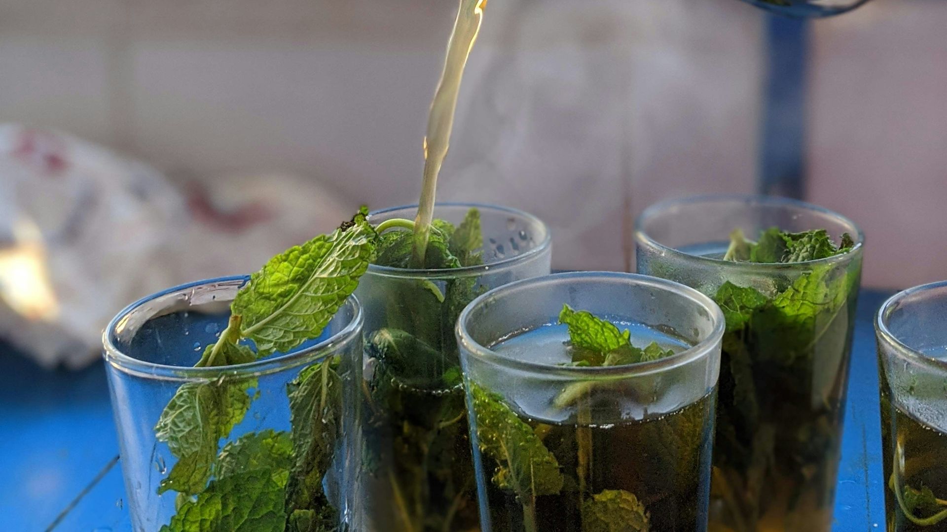 clear drinking glass with green leaves