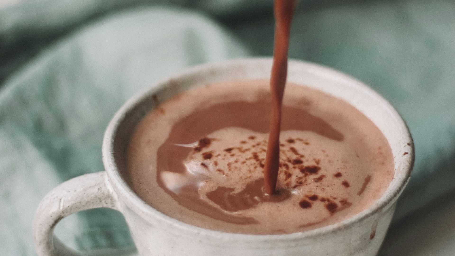 chocolate coffee pouring in white mug