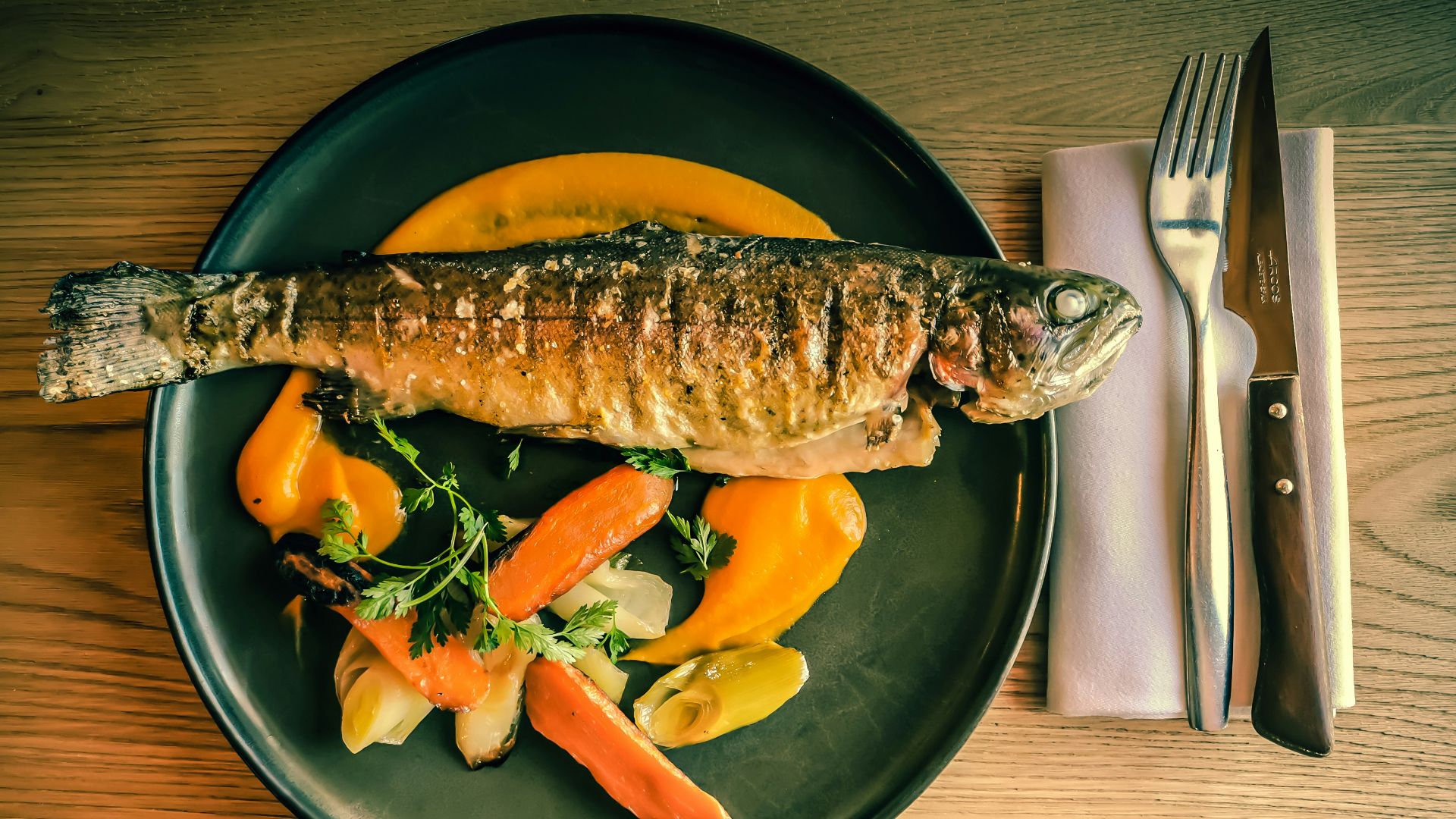 fish dish on blue ceramic plate