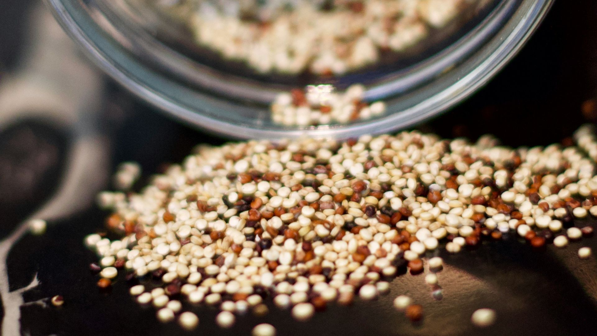 brown coffee beans in clear glass jar