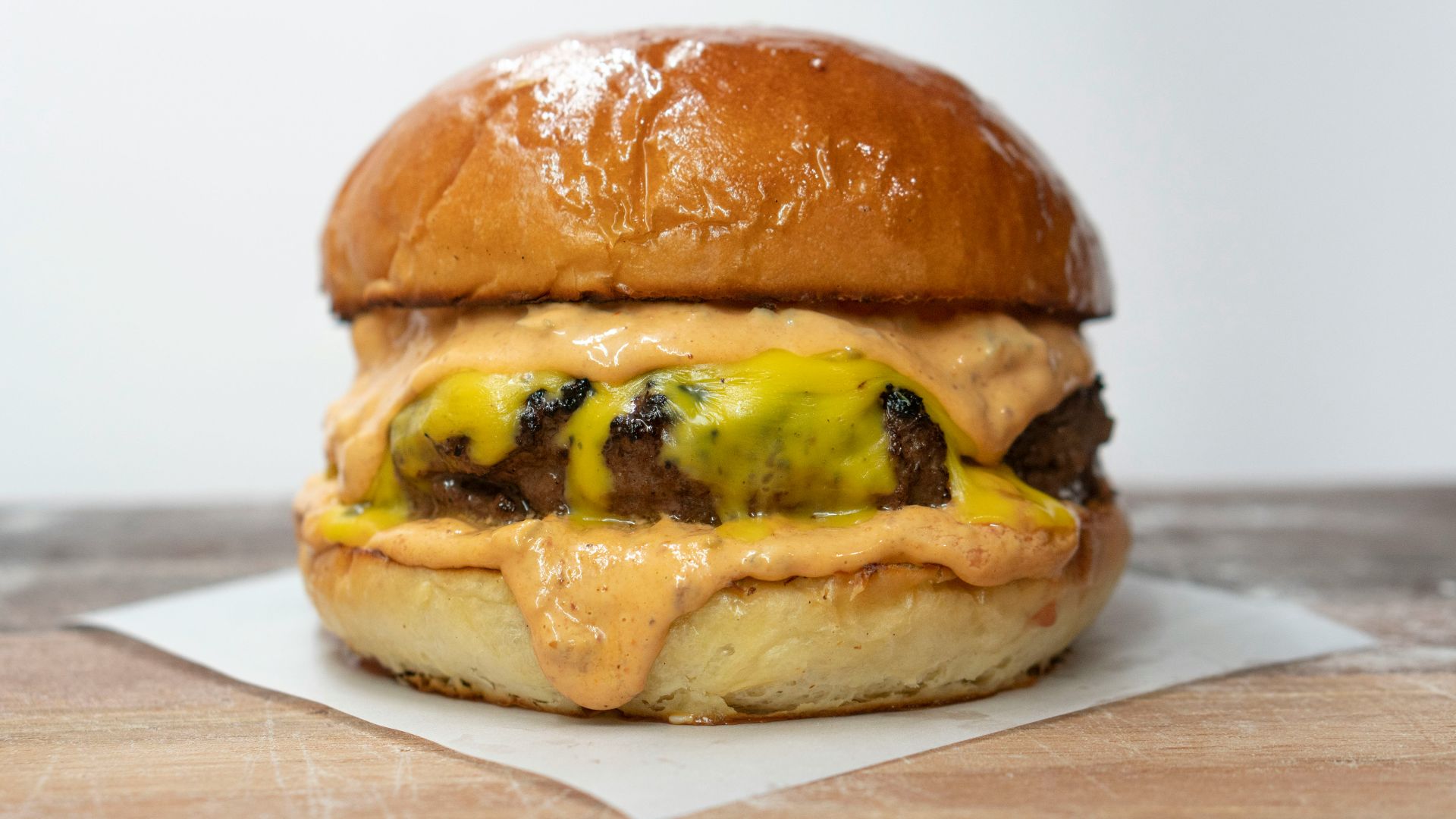 burger on brown wooden table