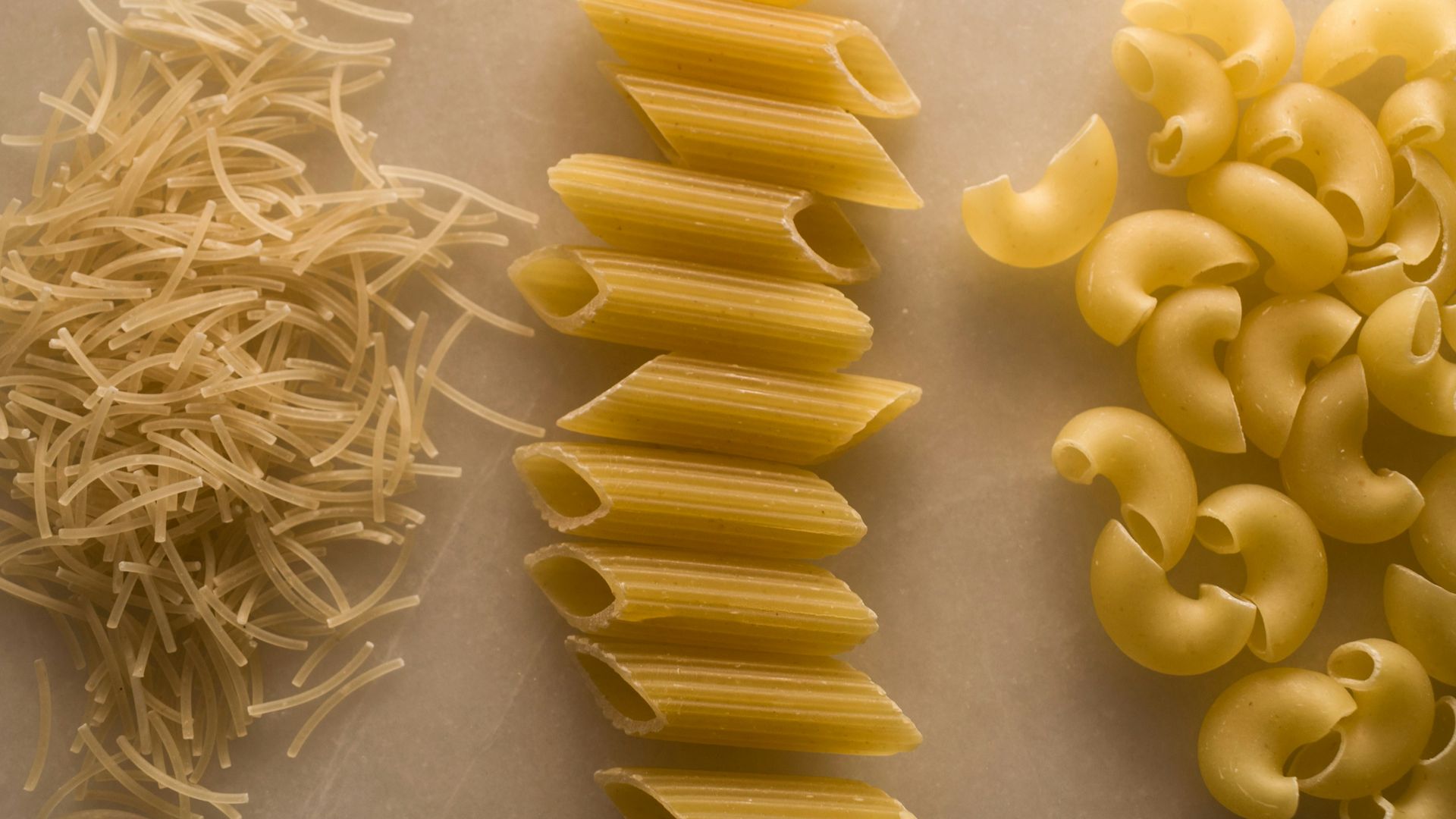 yellow pasta on white table