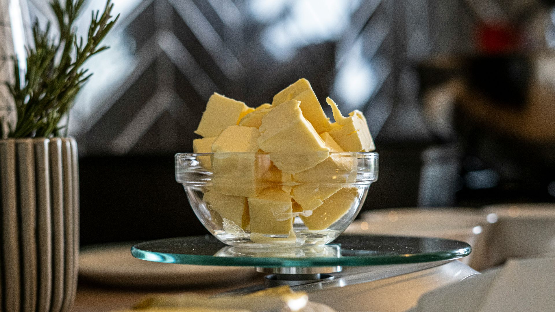 yellow cheese on green and white ceramic plate