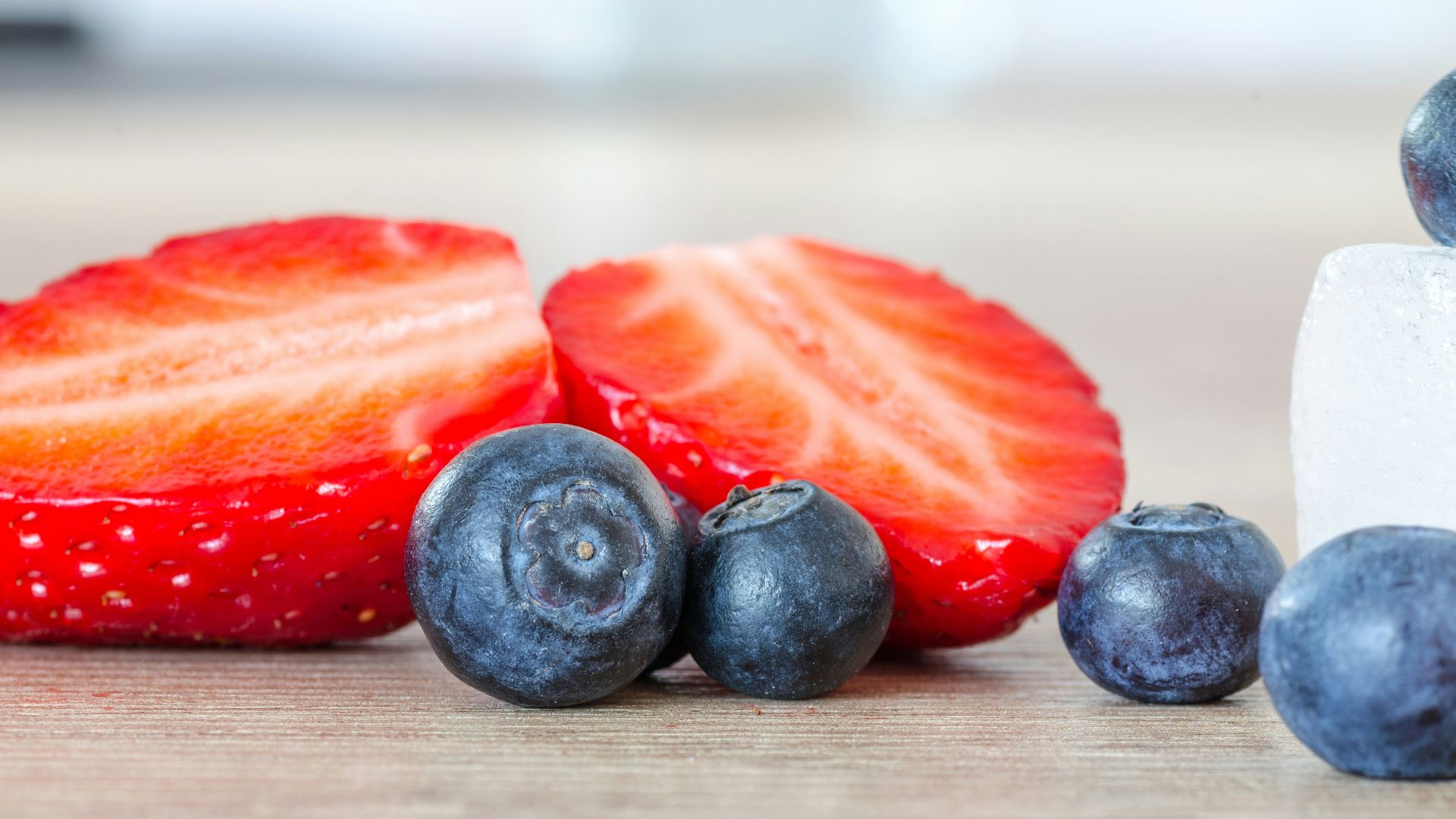 selective focus photography of strawberry and blueberries