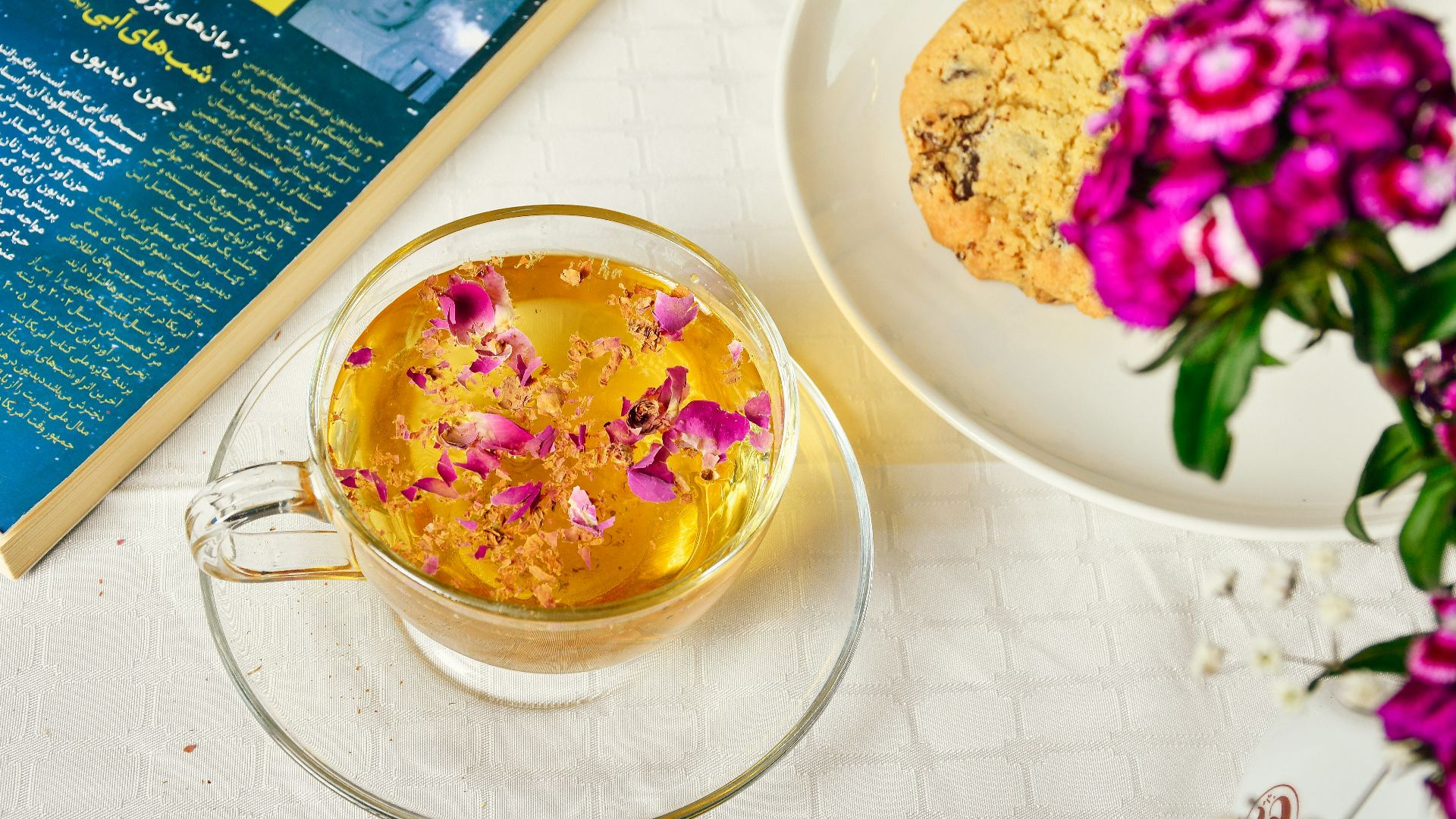 a bowl of food next to a flower