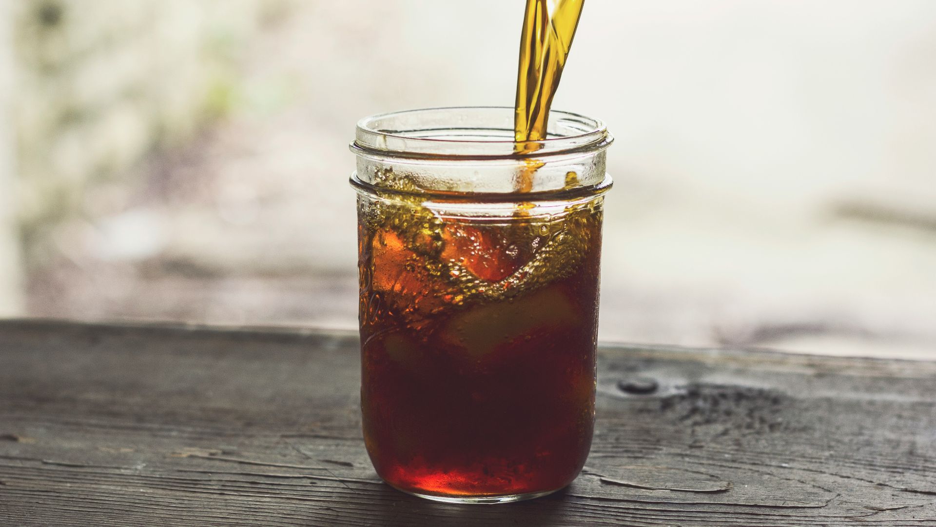 clear glass jar with yellow and red liquid