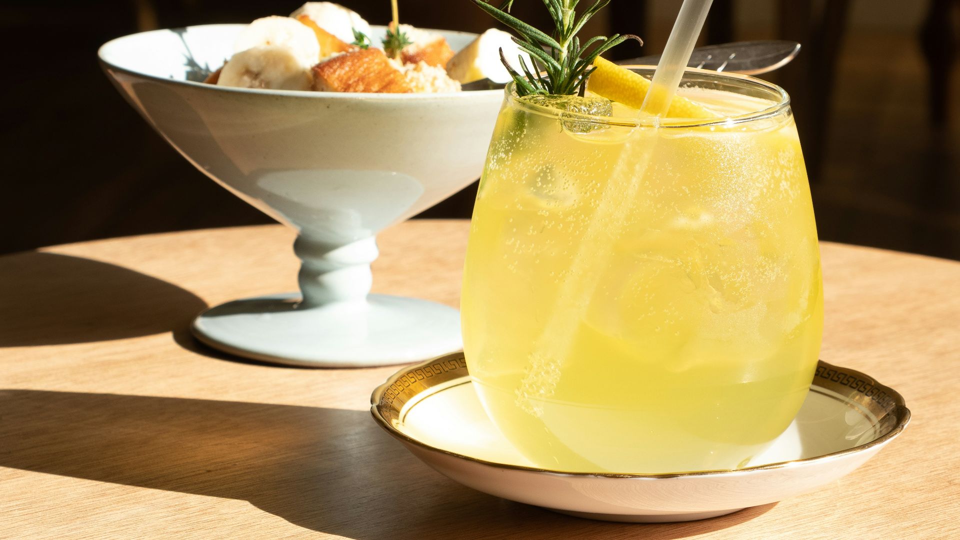 full-filled drinking glass on saucer