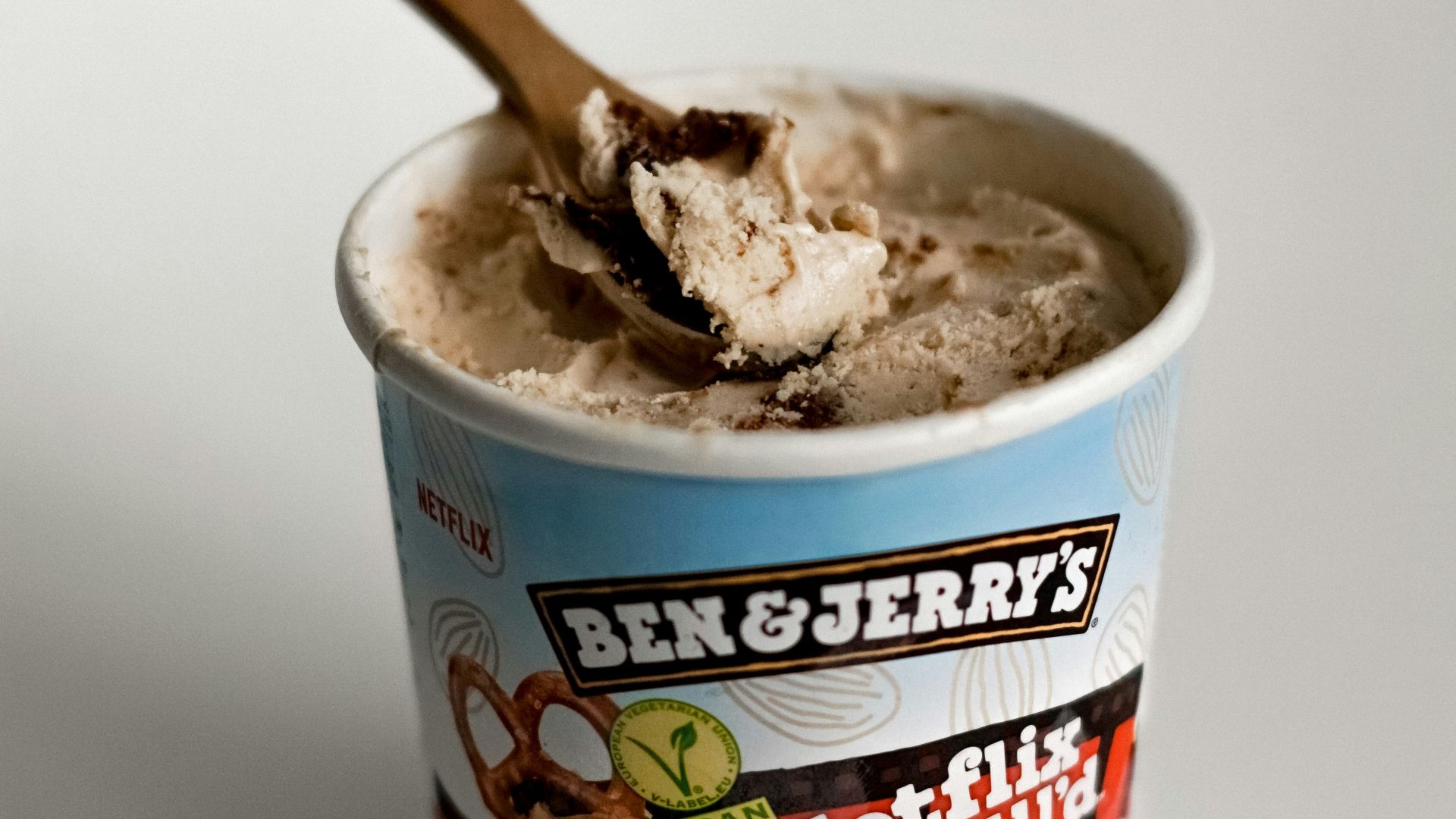 a cup of ice cream with a spoon in it