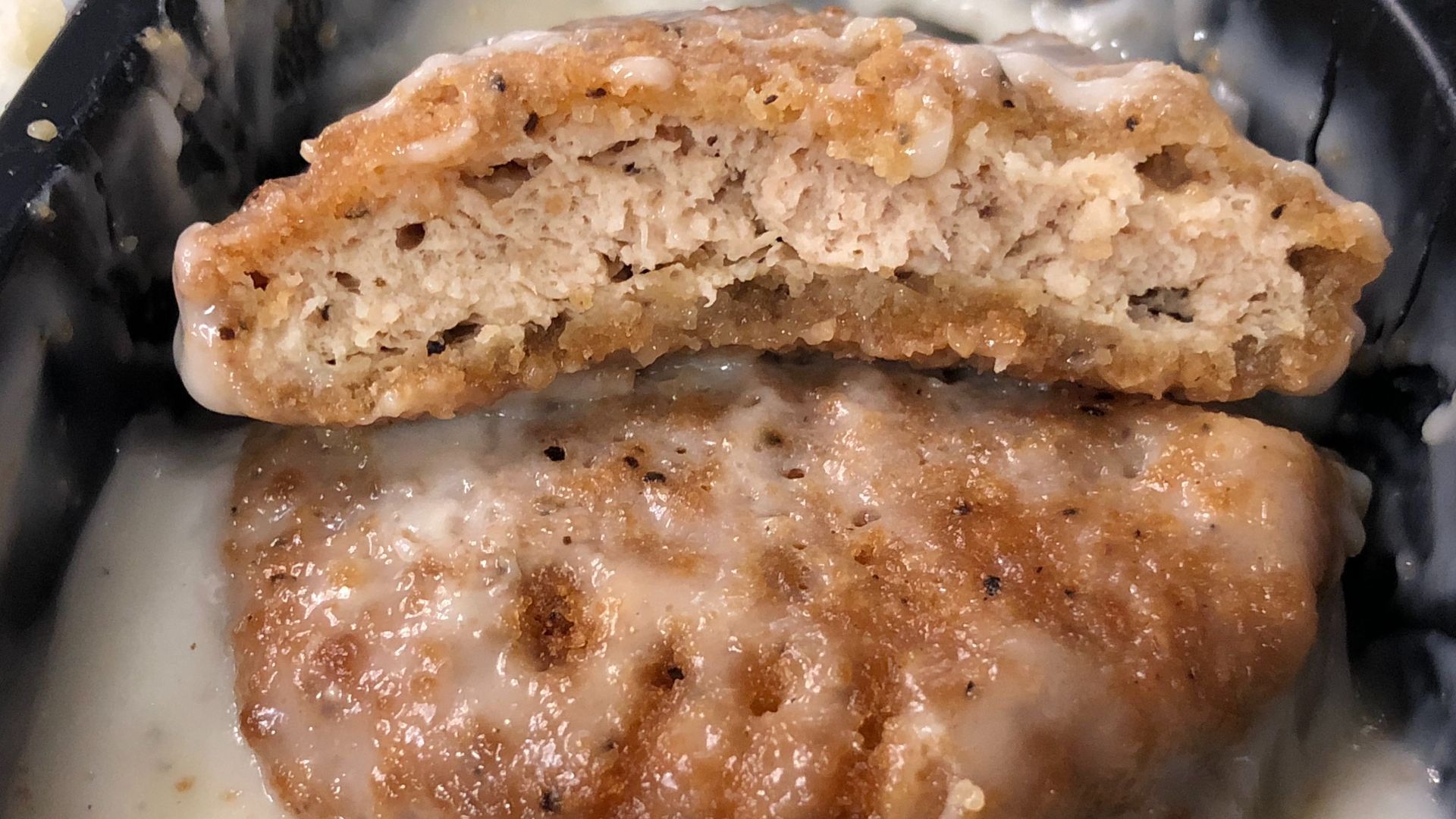 File:2020-03-07 22 38 10 A breaded white meat chicken breast patty with rib meat and home-style gravy cut into two pieces from a Hungry-Man Country Fried Chicken TV dinner in the Dulles section of Sterling, Loudoun County, Virginia.jpg