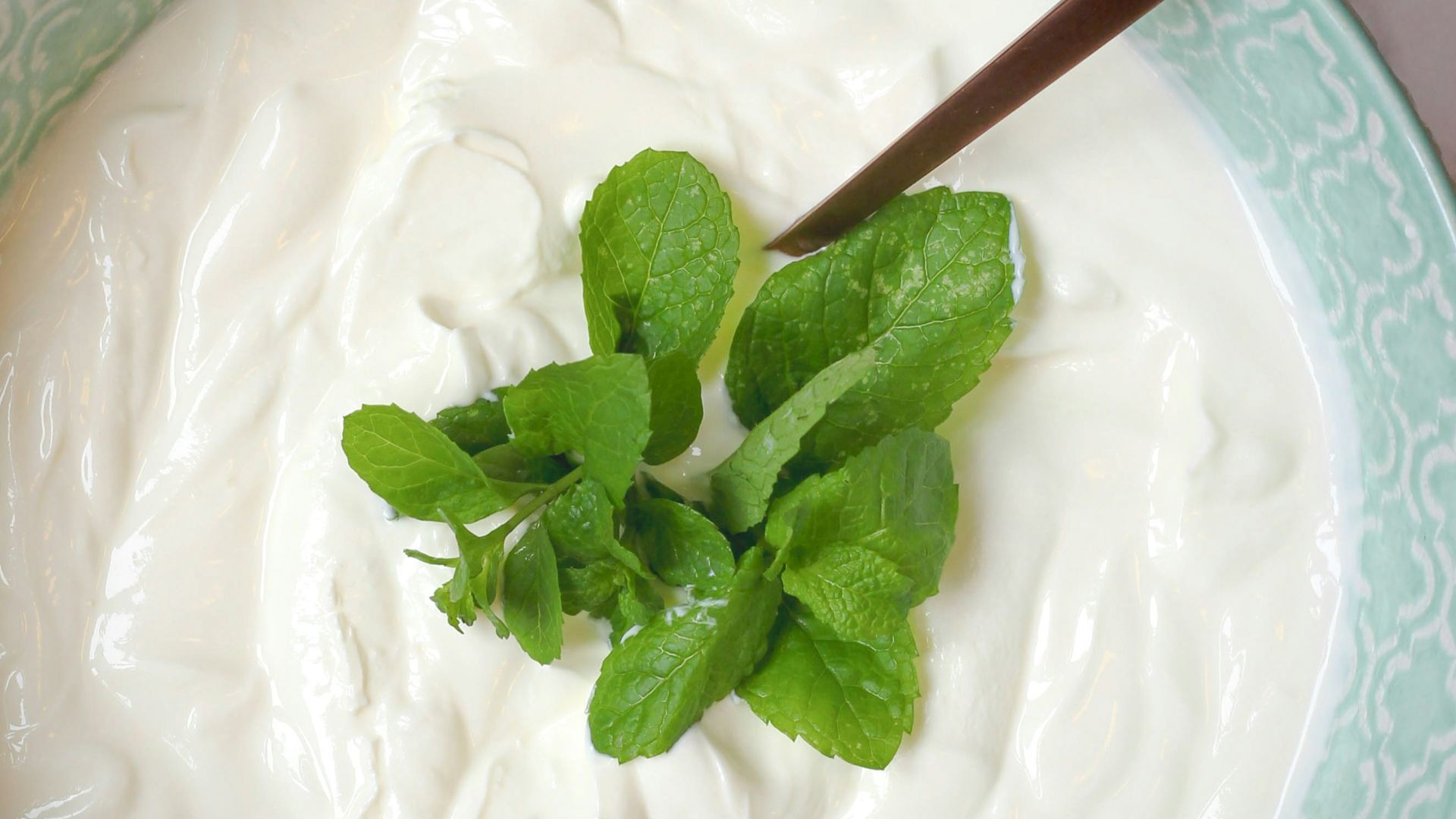 a bowl of yogurt with a spoon in it