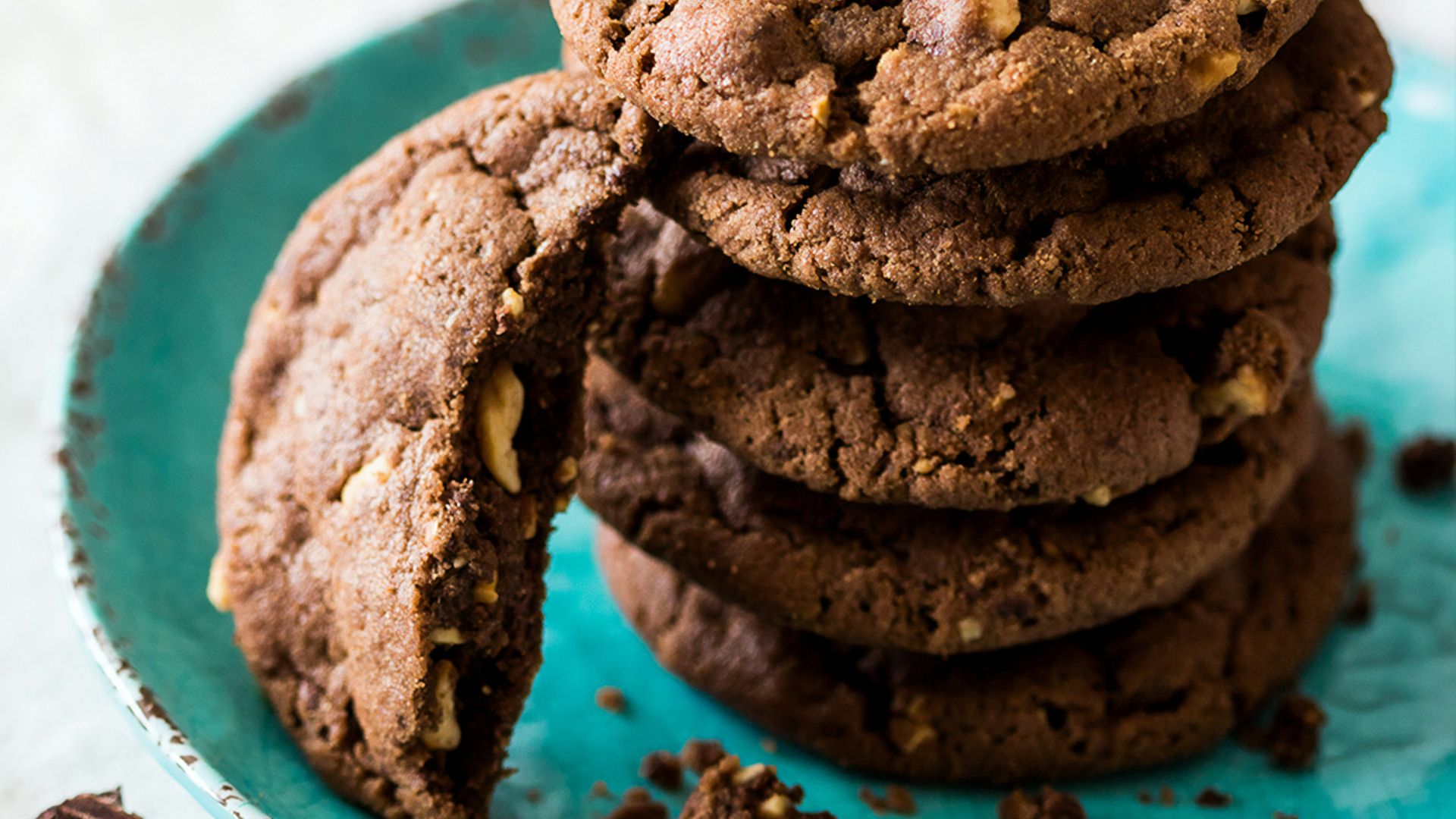 brown cookies on blue and white ceramic plate