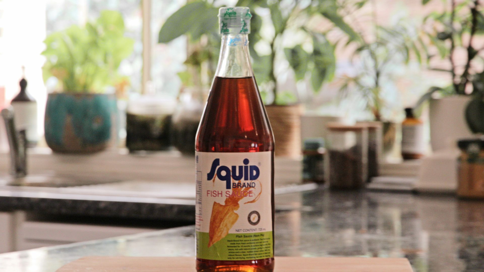 a bottle of liquid sitting on top of a counter