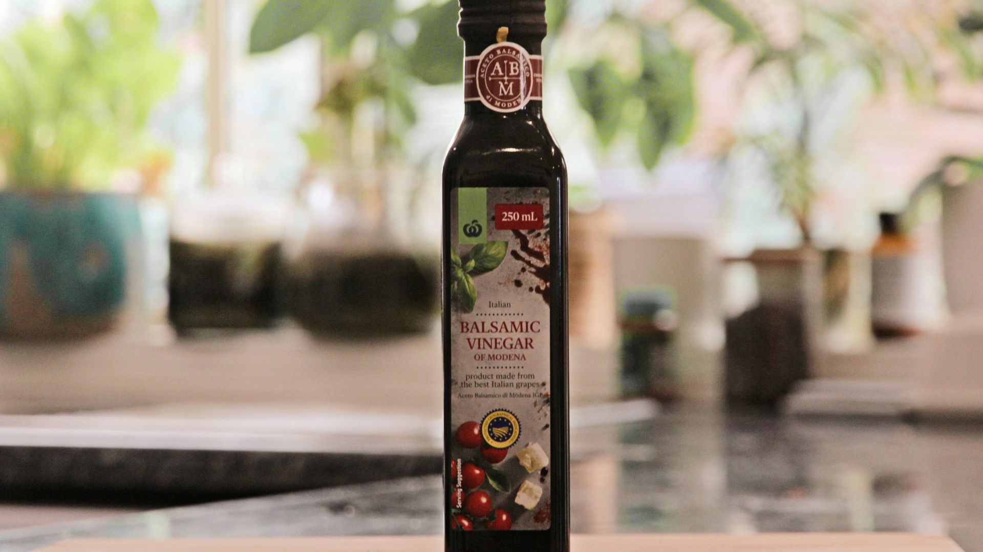 a bottle of extra virgin olive oil sitting on a cutting board