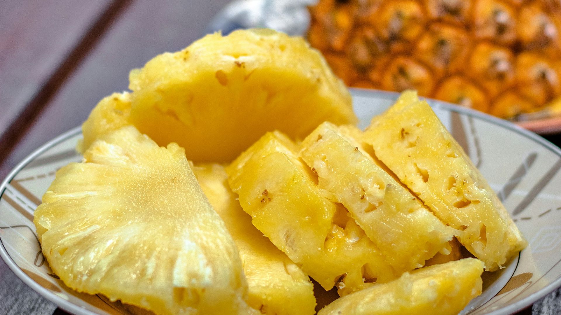 sliced pineapple on white ceramic plate