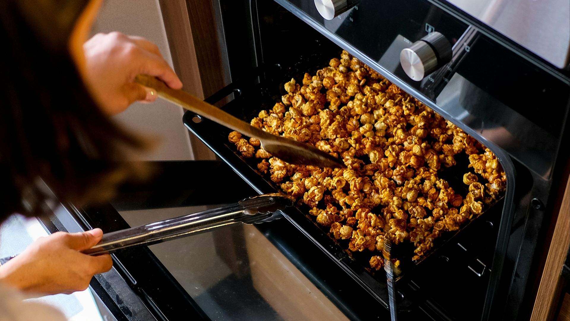 person holding brown wooden stick