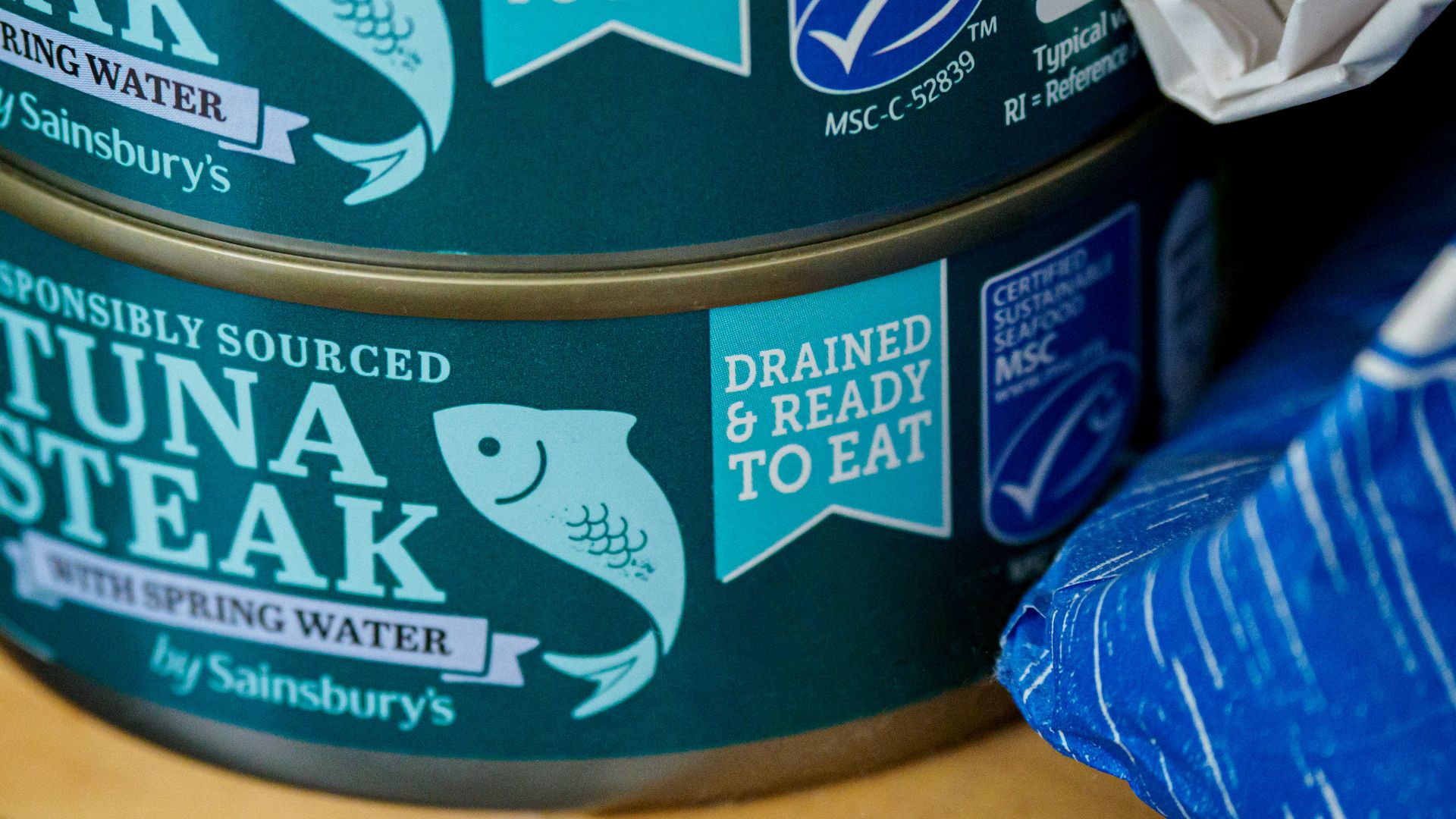 blue and white labeled can