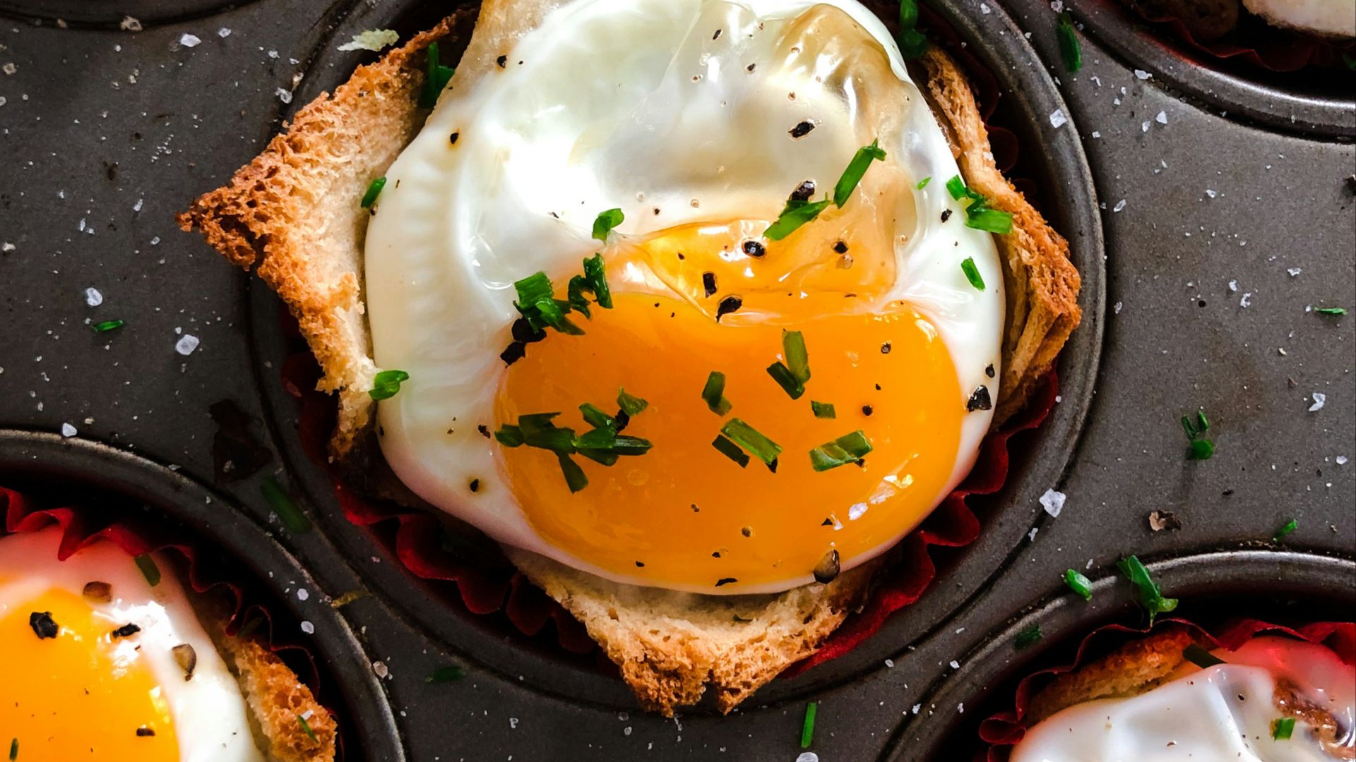 brown and white pastry on black tray
