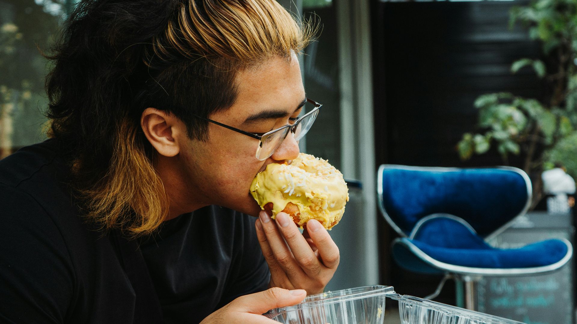 a person eating a pastry