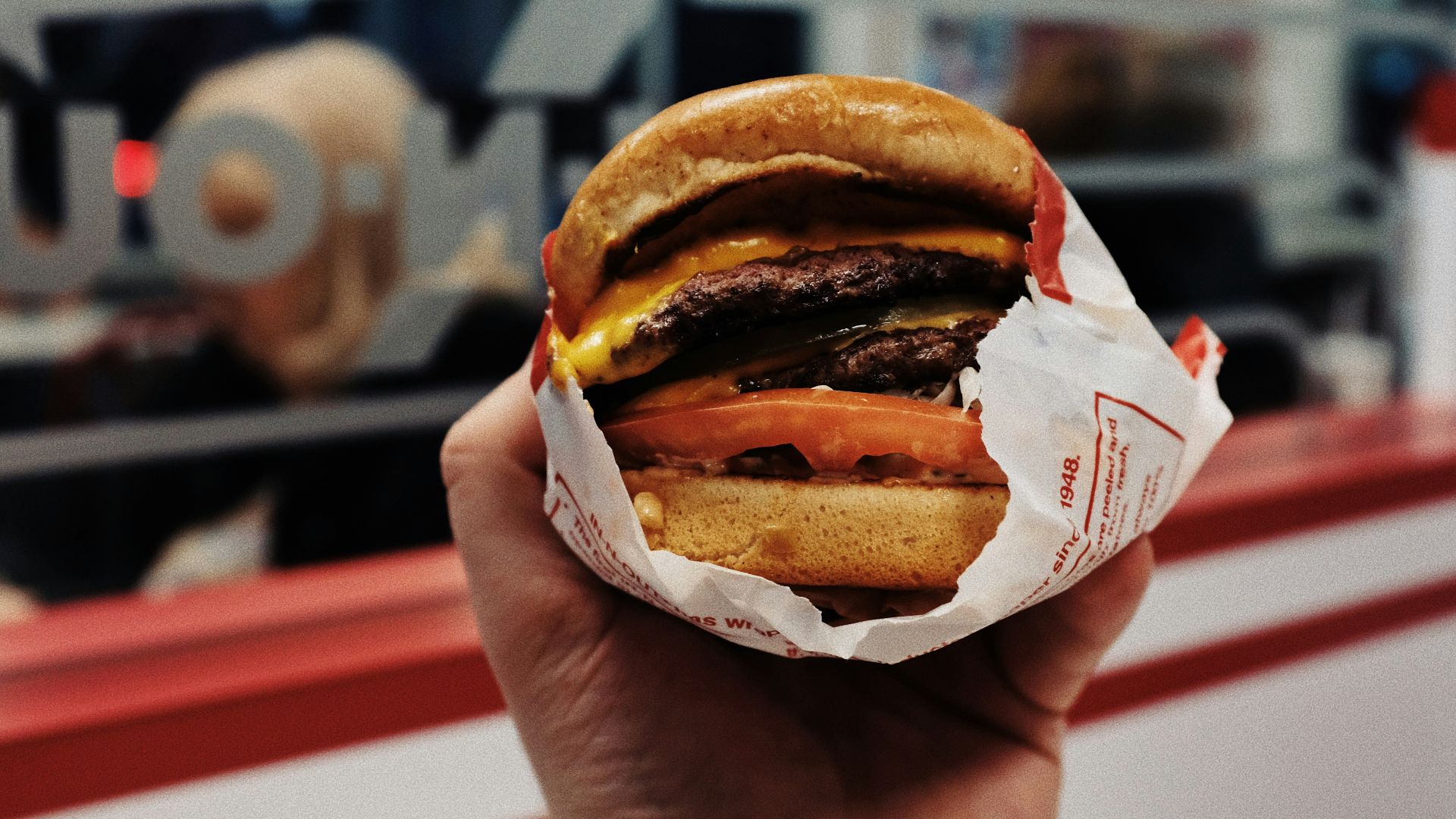 person holding hamburger