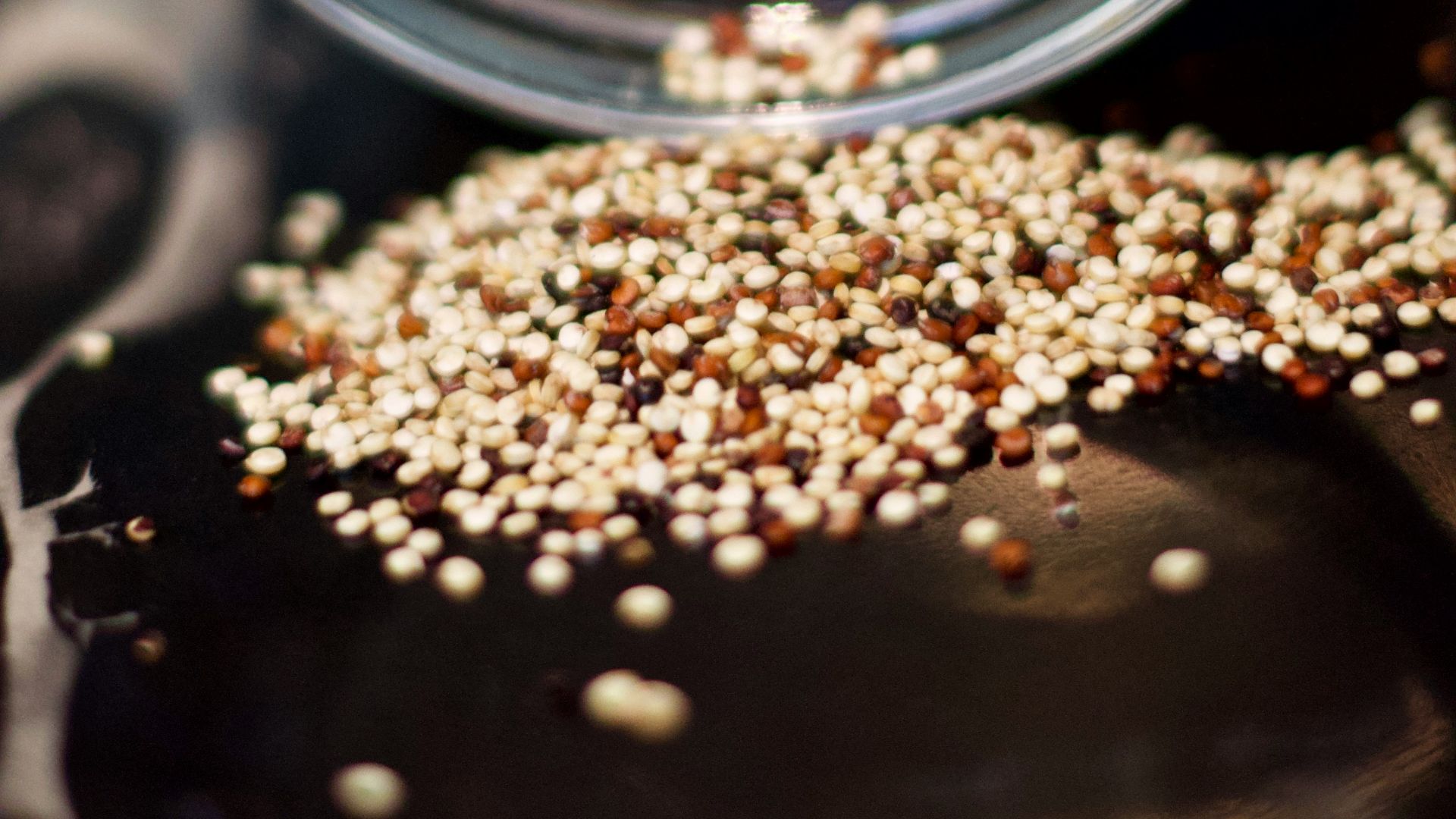 brown coffee beans in clear glass jar
