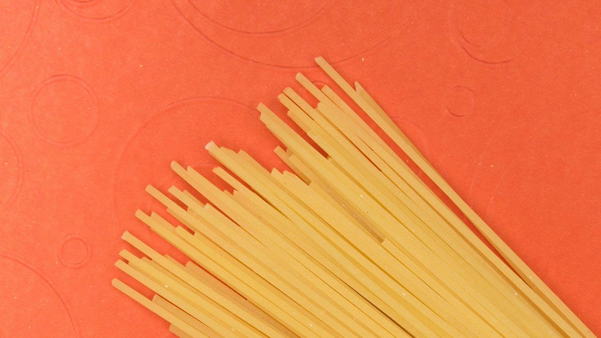 brown wooden sticks on red textile