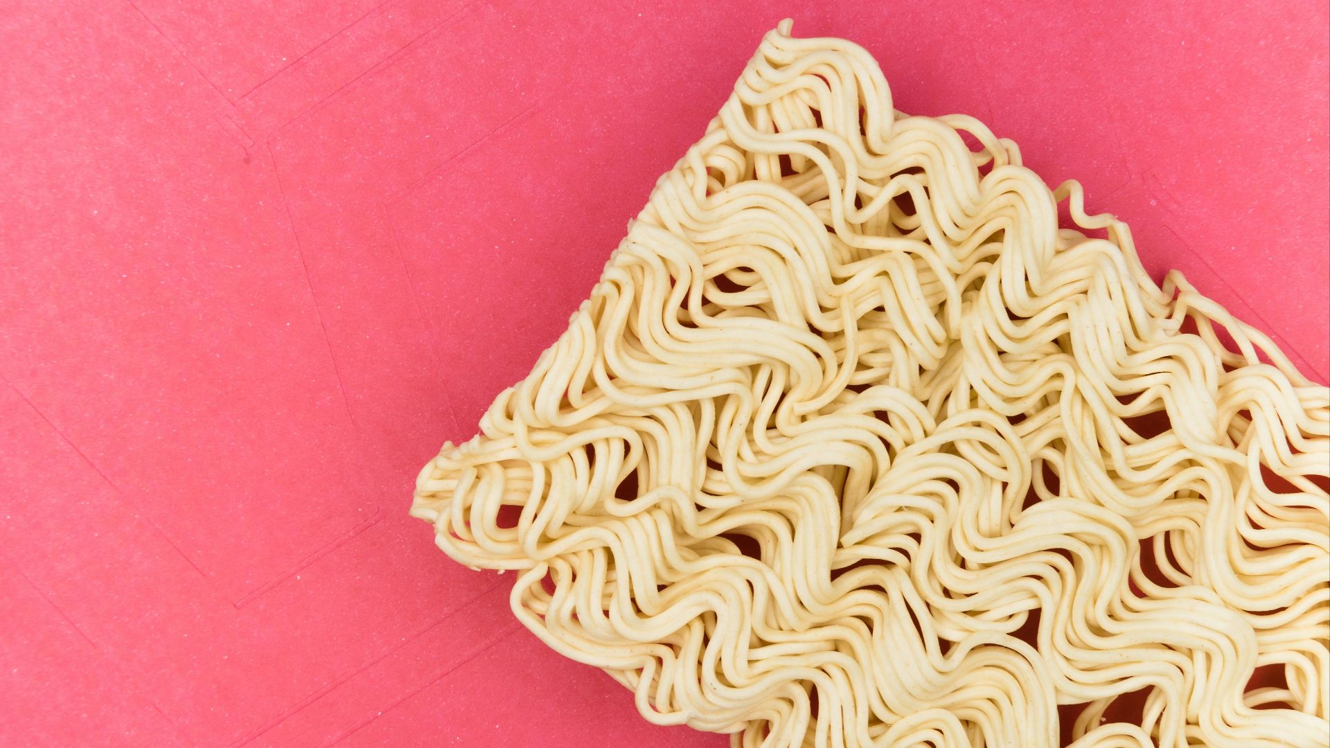 white and blue textile on pink textile