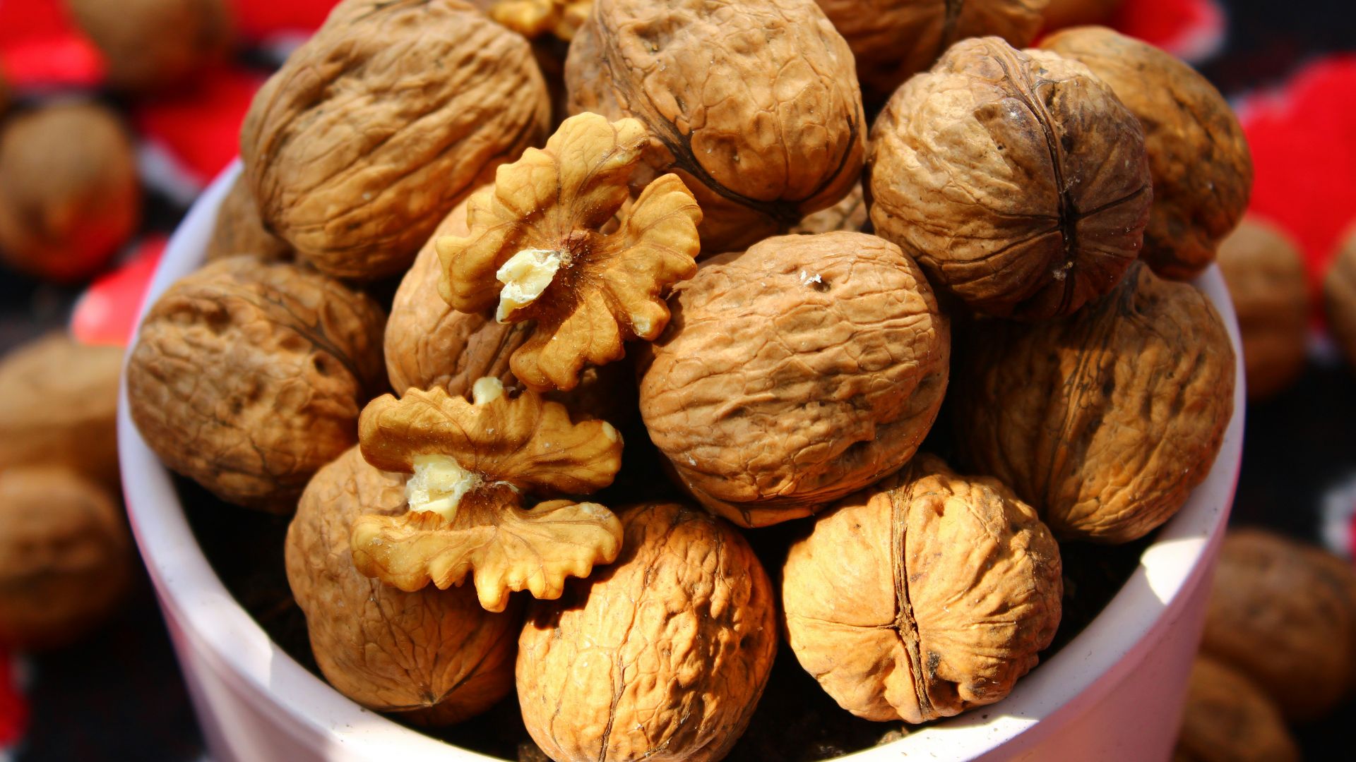 brown round fruit in white plastic container