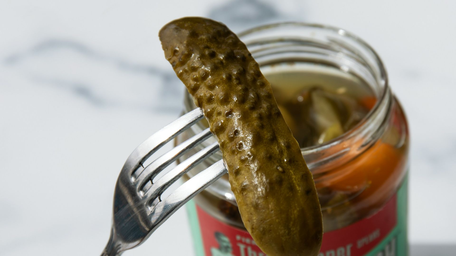stainless steel fork on green labeled can