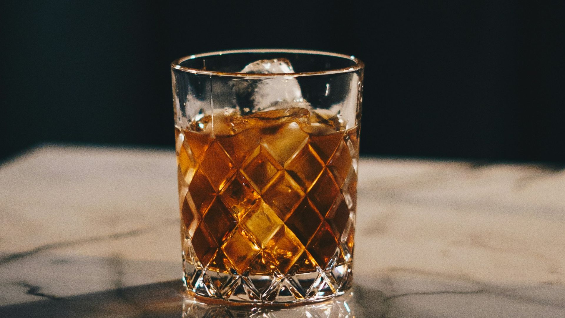 clear drinking glass with yellow liquid