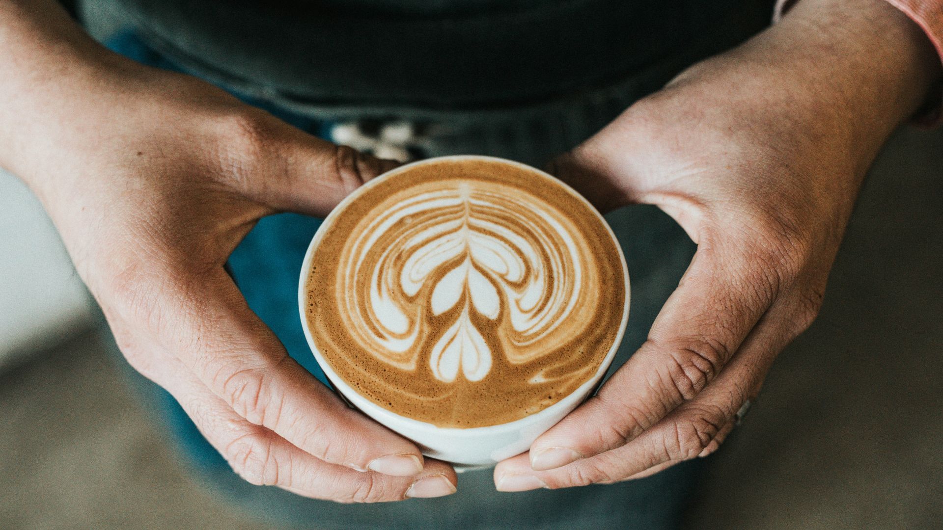 focus photography of coffee artwork