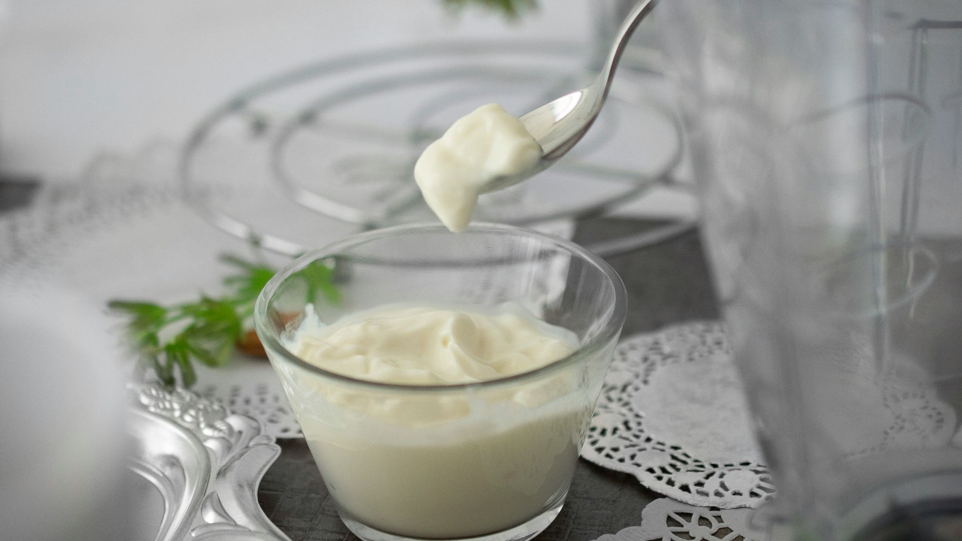 close-up photo of white cream in clear shot glass