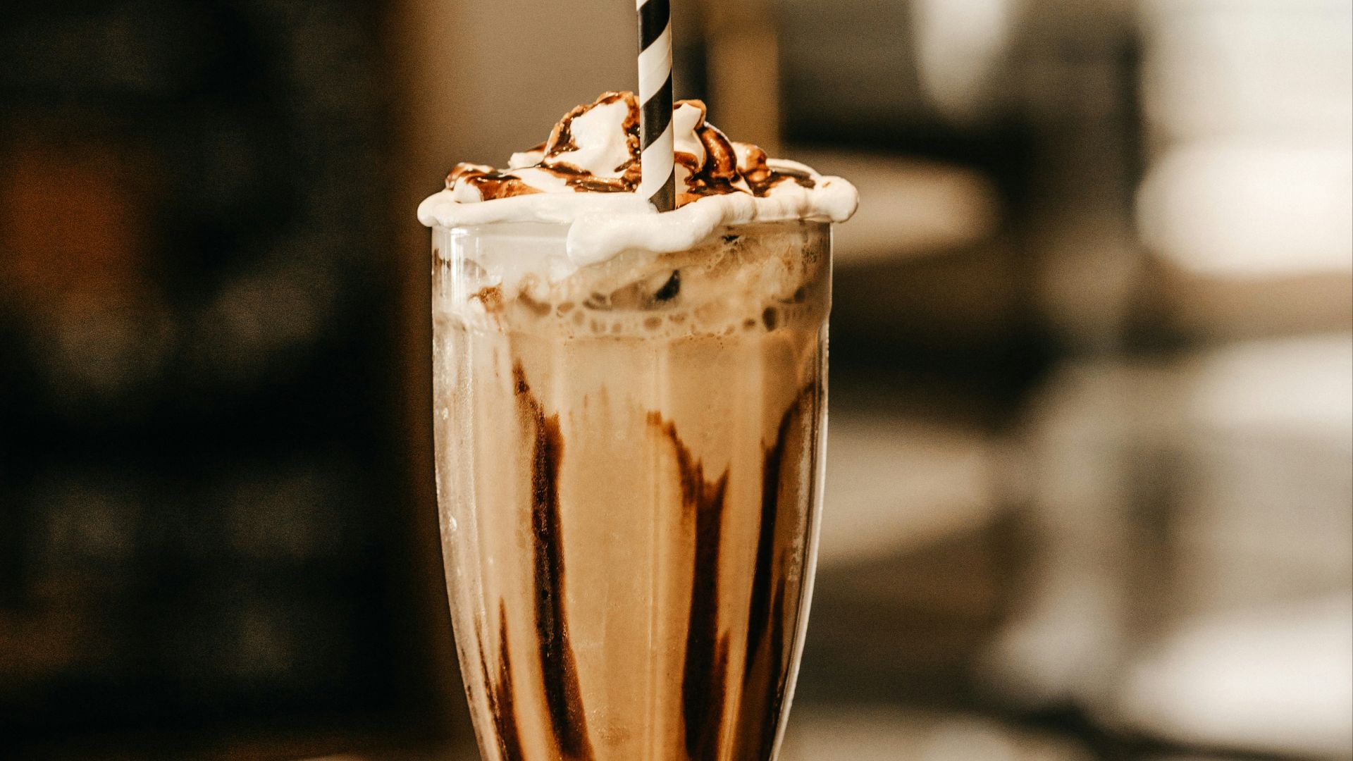 full-filled cream glass on table