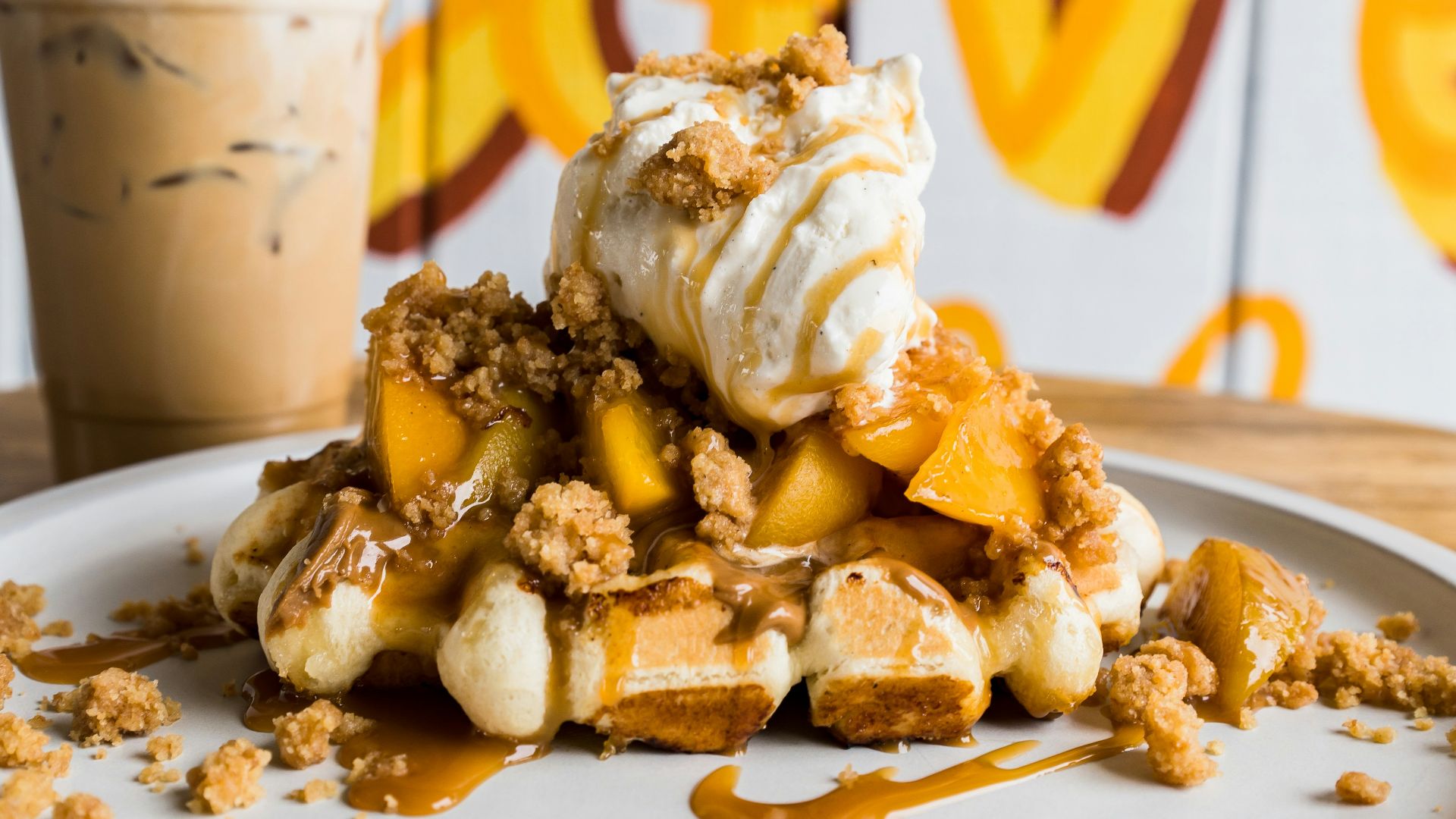 a white plate topped with waffles and ice cream